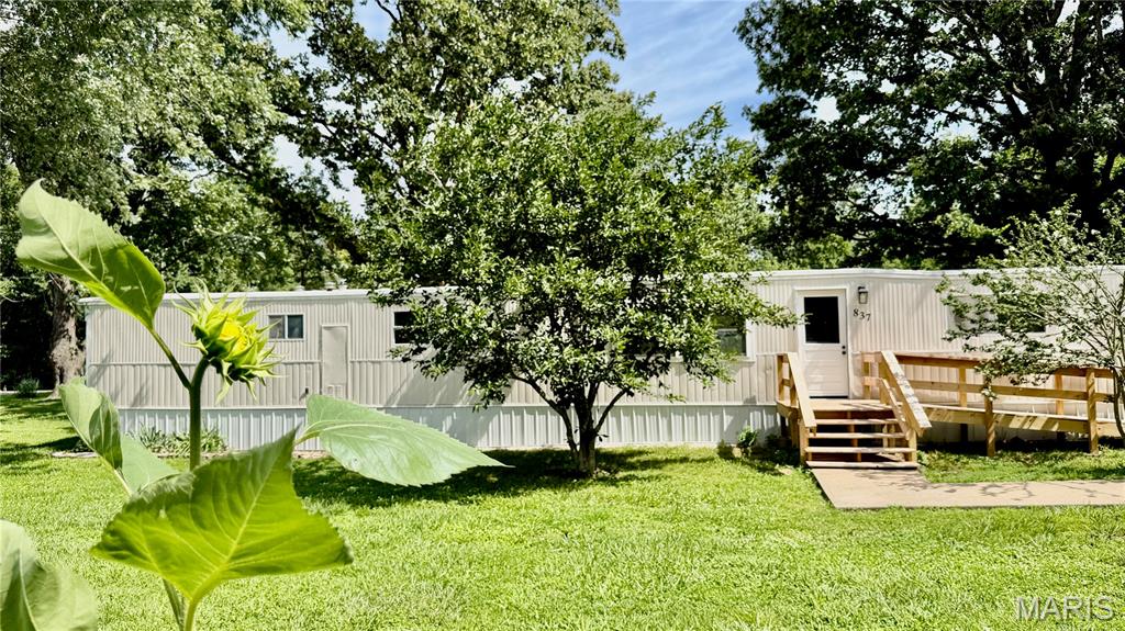 Welcome to 837 Dwight in Lebanon, Missouri! This beautifully renovated 2-bedroom, 2-bath manufactured home offers the perfect combination of modern updates and affordable living inside the city limits.
Nearly everything has been updated, including new plumbing, flooring, paint, windows, heat and air conditioning, and completely remodeled bathrooms. Enjoy relaxing on the brand-new front and rear decks, perfect for morning coffee or evening gatherings.
Situated on a spacious lot in a desirable neighborhood, this property offers plenty of room for gardening, outdoor activities, and additional storage with the included shed. Conveniently located just minutes from the local high school and city parks, you'll enjoy easy access to everyday amenities while still having room to spread out. Outdoor enthusiasts will appreciate being only 15 minutes from Bennett Spring State Park, one of Missouri's premier destinations for trout fishing, hiking, camping, and year-round recreation.

Best of all, this home is truly move-in ready and has already passed city inspection for added peace of mind. Whether you're looking for your first home, downsizing, or a vacation home to Bennett, 837 Dwight is a fantastic opportunity you won't want to miss!