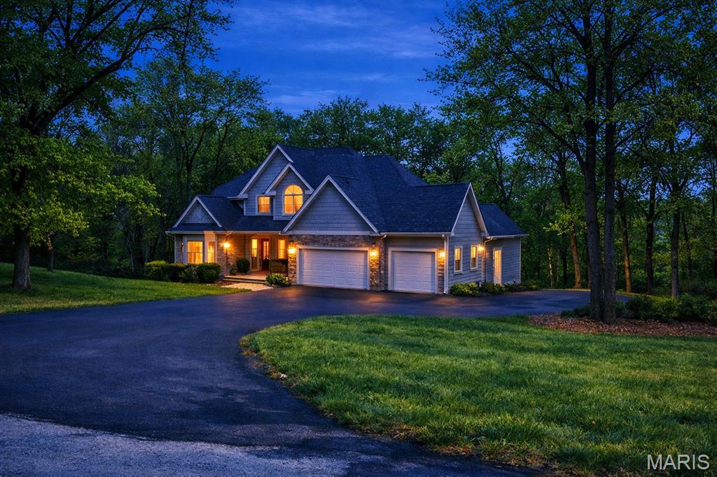 This amazing approximate 3700 total square ft home could not be built for this sales price !!!!Imagine coming home to a 5- bedroom, 3.5-bath residence nestled in a serene 7-acre wooded setting, offering the perfect balance of privacy, convenience, and modern comfort. Just minutes from a major highway, this location delivers the peaceful feel of country living while keeping everyday amenities within easy reach.   A spacious entryway welcomes you inside, opening to hardwood floors throughout main level, and expansive windows that bathe the home in natural light and showcase the surrounding trees. The heart of the home is a well-appointed kitchen featuring a spacious center island, custom cabinetry, and an adjoining breakfast room with views of the wooded landscape. The main- level primary suite provides comfort and convenience, while the upper level offers three additional bedrooms, a large full bathroom, giving everyone their own space. The finished lower level expands your living options with a large family room, a large bedroom, a spacious full bath with separate shower, making this area ideal for guest, or extended family. Extra room for home office or craft area, lots of storage space. Spend your evenings just sitting enjoying a cup of coffee on this great deck just thru the family room double doors. The sale also includes two additional parcels that may be suitable for future building.