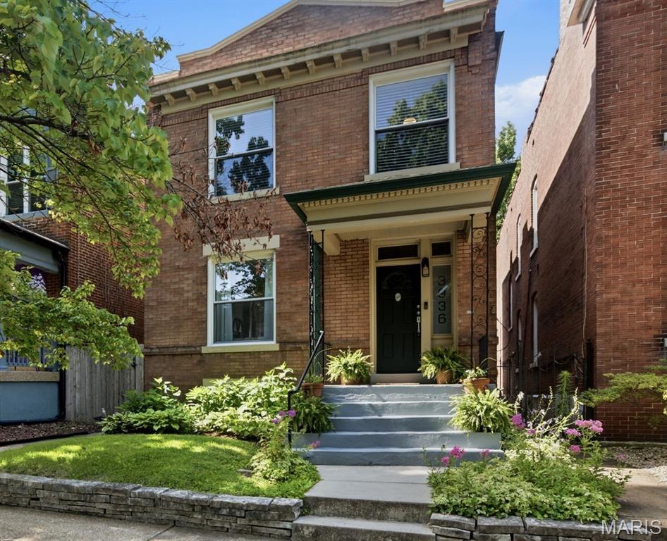 Welcome to 3936 Wyoming! A beautiful home combining classic architecture and details with modern updates blocks away from dining, shopping and Tower Grove Park! Walk in the front door and find a spacious living room with a decorative fireplace and gorgeous hardwood floors that continue throughout the home. The living room leads into a large light filled dining room perfect for hosting friends and family. The kitchen features stylish cabinetry, stainless steel appliances and updated light fixtures. Just off of the kitchen you will find a large bonus/breakfast room with an exposed brick wall. A half bath completes the main floor. Head upstairs and find 4 bedroom and an updated full bathroom. The main bedroom features a stunning decorative fireplace and plenty of closet space. New carpet has been installed in the 4th bedroom that could also be used as a family room. The unfinished basement offers plenty of storage and a walkout to the fully fenced backyard with a deck and spacious two car carport with an EV electric panel. The yard has plenty of room for furry friends, kiddos and back yard hangs and includes a storage shed. Now for the updates - Foundation and interior wall tuckpointing in 2026, renovated upstairs bathroom, new TPO roof and carport in 2024. Additional updates include refinished kitchen floors, fresh paint, ceiling fans and more. So much to love about this great house in one of STL's most desirable neighborhoods.