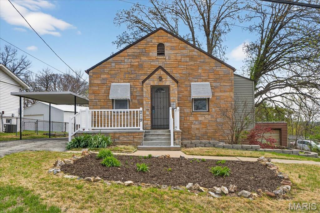 Back on the market with a fresh look, brand new Kitchen, freshly painted, and a brand new roof on the garage!!!  This charming 2 bed, 2 bath stone bungalow welcomes you with a cozy front porch—perfect for relaxing evenings. Step inside to high ceilings and luxury vinyl plank flooring that create a warm, inviting atmosphere in both the living room and dining room. The eat-in kitchen offers a lovely spot to enjoy your morning coffee while overlooking the backyard. Both bedrooms provide ample closet space, with one featuring carpet and the other LVP flooring. Two full bathrooms and a conveniently located main-floor laundry room add comfort and ease to everyday living.  The house has solar panels installed and the monthly avg electric bill is only $50!!! The walkout basement offers abundant storage and great potential for future expansion. Outdoor living is a delight with a patio that overlooks the fenced backyard, complete with a stone firepit. A covered carport and a detached 1-car garage provide plenty of parking and protection from the elements. For information regarding the above ground pool please refer to the seller's disclosure. Ideally situated near Hwy 141, this home offers quick access to shopping, restaurants, and schools.