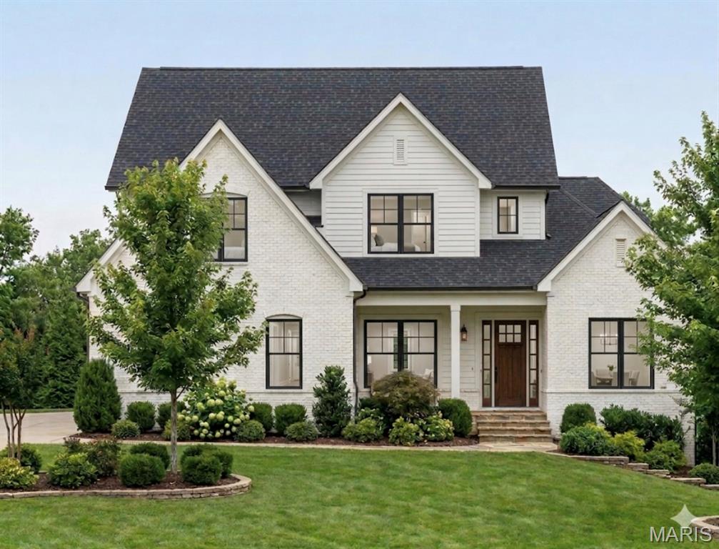 New Plan w/ main floor Primary Suite. Experience luxury living in this stunning new construction home located in the highly acclaimed Ladue School District. Thoughtfully designed with soaring ceilings, an open-concept layout, rich hardwood flooring, and impeccable craftsmanship throughout, this custom residence offers the perfect blend of elegance and functionality.
At the heart of the home, the chef’s kitchen flows effortlessly into the sunlit breakfast room and expansive living spaces, creating an ideal setting for both everyday living and entertaining. The main level also features a formal dining room, private office, and a luxurious primary suite retreat. Upstairs, you’ll find four spacious bedrooms, including two with private ensuite baths and two connected by a Jack-and-Jill bath, along with the convenience of a second-floor laundry room. The finished lower level adds exceptional versatility with a large recreation room, additional bedroom, and full bath—perfect for guests, extended family, or a private retreat. Step outside to enjoy the covered patio overlooking the generous backyard, offering ample space for a future pool and outdoor oasis. Complete with a 3-car garage, this exceptional home delivers timeless style, modern comfort, and an unbeatable location.