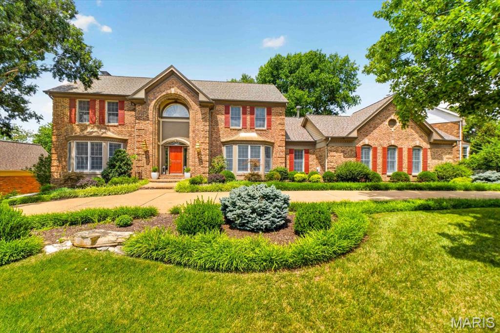 Welcome to 14673 Summer Blossom Lane, a beautifully appointed two-story in the popular Seasons of Schoettler, offering exceptional space, extensive recent improvements, and a timeless floor plan designed for both comfortable everyday living and effortless entertaining. From the moment you enter the dramatic two-story foyer, the home feels upscale, with soaring ceilings, refined millwork, abundant natural light, and generously proportioned rooms throughout. The main level offers a wonderful balance of formal and casual living spaces, including an expansive family room with limewashed gas fireplace, elegant dining room with coffered ceiling, and a spacious kitchen with center island, updated countertops, abundant light through the skylight, generous cabinetry, and an adjoining breakfast area. Upstairs, the impressive primary suite provides a private retreat highlighted by coffered ceilings, a large walk-in-closet, and a beautifully remodeled bath and generous closet space. Additional bedrooms are comfortably sized and thoughtfully arranged, offering flexibility for family, guests, or home office needs. Two of the upstairs bedrooms share a jack and jill bath while the other bedroom has its own private bathroom.The finished lower level adds another dimension to the home, with expansive recreation and entertaining space, an additional bedroom, a full bath,  a second kitchen area with cabinetry and countertops, and excellent storage. Improvements include a newer architectural roof, replacement windows, new HVAC systems, refinished hardwood floors, fresh interior paint, new carpet, updated countertops, a remodeled primary bath, and a newer deck. Additional features include two fireplaces, extensive crown molding and millwork, a three-car back entry garage, aggregate circle driveway, irrigation system, security system, and beautifully established landscaping accented by substantial rock walls. The outdoor spaces provide a natural extension of the home, with a spacious deck and landscaped grounds ideal for relaxing or entertaining. Conveniently located near Chesterfield AND Town and Country's shopping, dining, schools, parks (steps to Logan Park), and major roadways, 14673 Summer Blossom Lane truly has it all!
