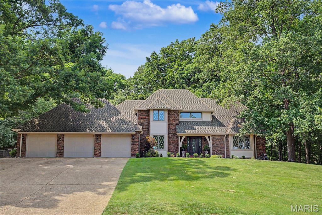 Discover over 3,500 square feet of living space in this stunning contemporary two-story home nestled on approximately 5 wooded acres in the heart of town. Rustic charm, peaceful surroundings, and exceptional privacy make this one-of-a-kind property a true retreat.
The impressive great room features soaring volume ceilings with warm wood accents, a massive floor-to-ceiling stone fireplace, a wet bar, and an abundance of windows overlooking the spectacular pool and outdoor entertaining area. The cozy sunroom is filled with natural light, creating the perfect space to relax year-round.
The main level offers a spacious primary suite, formal dining room, and functional living spaces designed for both everyday living and entertaining. Upstairs, you'll find three generously sized bedrooms and two full baths, providing plenty of room for family and guests. Enjoy endless summer days with family and friends in the spectacular outdoor living space featuring an inviting in-ground pool, spacious dining area, and grilling station. Whether you're hosting a backyard barbecue or simply relaxing poolside, this private outdoor oasis is designed for making memories. It truly doesn't get any better than this!