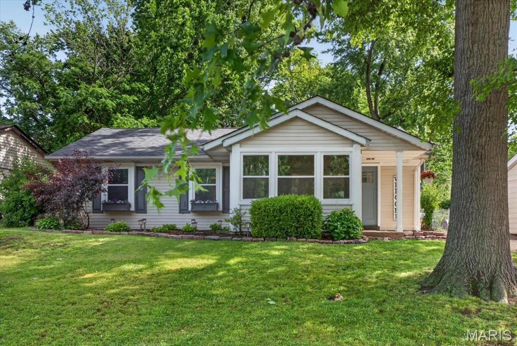 Welcome Home! Nestled on a beautifully landscaped lot shaded by mature trees, this charming
ranch-style residence perfectly blends comfort & character. From the moment you
arrive, the inviting covered front porch and picture-perfect bay window offer exceptional curb appeal. Step
inside to find an inviting living room flowing seamlessly into a eat-in kitchen
the true heart of the home. Kitchen includes custom
white cabinetry, a striking center island topped with warm butcher block, a classic farmhouse sink, gas
range, microwave, and dishwasher. Elegant, low-maintenance vinyl flooring flows flawlessly throughout the
entire main living space and all three bedrooms, making day-to-day cleaning a breeze. The primary
bedroom serves as a private retreat, complete with dual closets and its own direct access door
leading to the outdoor living area. Out back, enjoy your own private oasis featuring a spacious patio looking
out over a beautiful, fully fenced backyard—ideal for entertaining, children, or pets. This turnkey property is ready for its next story. Schedule your tour today!