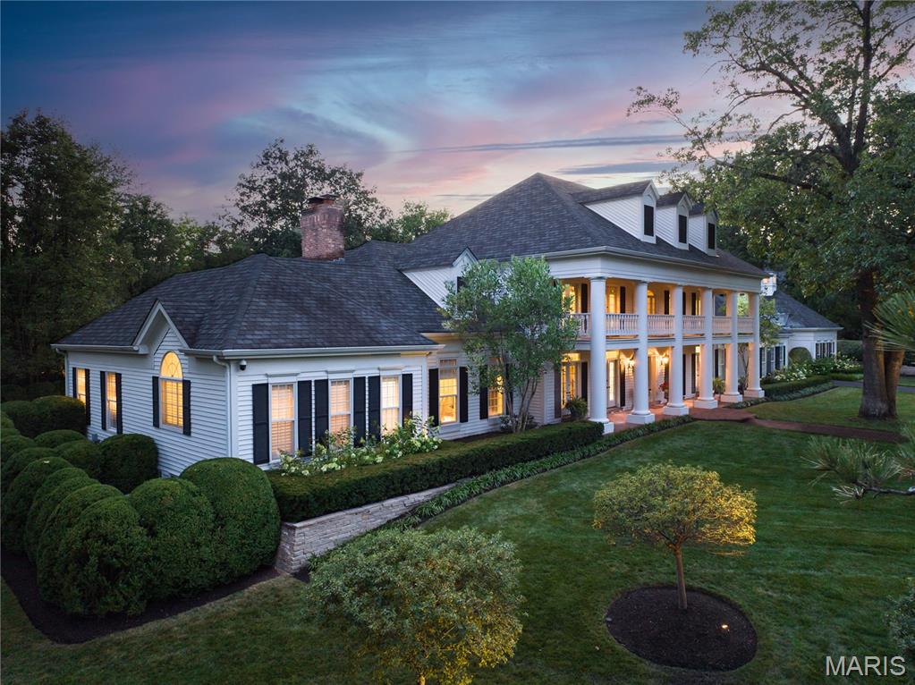 Exceeding every expectation. This Frontenac estate, situated on a gated, private cul-de-sac, checks every box both inside and out. A Johnson-built executive custom home, with 5 bedrooms, 7 baths and over 7,600 square feet of living space in the main house, plus an additional detached two-story guest house. The grounds are meticulous and a statement in perfection, featuring resort quality fountained pool, spa, artfully designed landscaping with uplighting, vine enveloped pergola with brick fireplace, and a world class heated screened veranda with accordion glass doors creating the ultimate indoor/outdoor living space. The interiors seamlessly blend refined and casual living spaces, and incorporates modern convenience of a Lutron Radio RA Lighting control. A fully remodeled and expanded chefs kitchen was thoughtfully designed to be the anchor of the home. Double islands, expansive windows allow sweeping views of pool and grounds, top tier appliances and abundant storage. The Primary suite is a retreat, with coffered ceiling, light filled spa-inspired bath with ventana marble, dual organized closets, and oversized shower. 2nd level hosts 4 generously sized bedroom suites (currently 2 suites are combined.)  Lower level offers recreation rooms, home theater and temperature controlled wine storage. The Guest House provides abundant living space, a spacious bedroom suite, wet bar and wine chiller. Garage is 4 car and oversized. Elite security with controlled access and cameras.