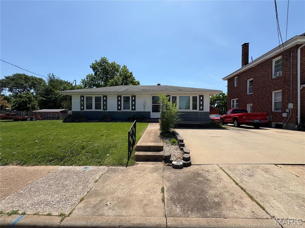 Finally! A move-in-ready 3/1 with full unfinished basement with covered walk-up and fenced in back yard close to downtown amenities on West 5th st. This type of home and price range is hard to find these days so don't miss out on your opportunity to get it before it's gone. All appliances stay in the roomy eat-in kitchen and if you didn't need the 3rd bedroom next to the kitchen, it wouldn't be too difficult to open it up to be a large dining room and maybe even add main floor laundry there too while you're at it. If you've been wanting 3 bedrooms and a room for fun and games or a workshop area and storage, then the nice clean basement would be perfect for it. Newer systems less than 5 years old will be that much less to worry about as well. Bring the fam, friends and furry four legged additions too, they will love it.