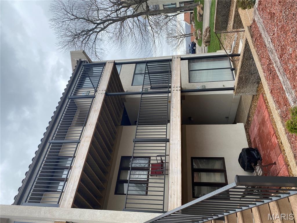 Updated 3rd-floor condo in Osage Vistas at Lake Ozark offering a partial lake view and resort-style living. This 2BR/2BA unit features an eat-in kitchen with stainless steel appliances, living/dining combo with fireplace, wet bar, and washer & dryer included. Enjoy two patios, including a glass-enclosed porch with access from both the living room and primary bedroom, plus composite decking. The primary suite offers a jacuzzi tub, separate shower, double vanity, and walk-in closet. Community amenities include multiple pools, fishing access, boat slip, and a large entertainment pool with activities.  Owner-Agent