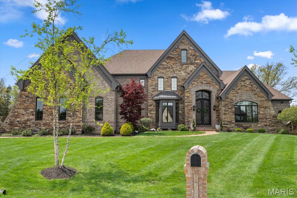 Gated estate in Lafayette Crossing, 6 bedrooms, 5 full & 1 half bath, with 8,050 square feet of luxurious living space. A grand foyer leads to a formal dining room & study. The great room features a stone fireplace & opens to a gourmet kitchen with 13-foot center island, 2 dishwashers, & high-end appliances. Main floor includes primary suite w an elegant ensuite bath & dual walk-in closets. Upstairs, find 4 spacious bedrooms, 3 full baths, a second large laundry room. The walk-out lower level is perfect for entertaining, featuring a lg family room, bedroom w an egress window, full bath, a brick & stone bar w granite countertops, an oven & dishwasher. This level also has a brick gas fireplace & leads to a patio with a hot tub. Outside, enjoy a custom saltwater pool with a waterfall & water slide, a covered screened porch with a stone gas fireplace, a walking trail, a creek, & firepit on a private 3-acre cul-de-sac lot with a 4-car garage. See supplements for a complete home update list. Additional Rooms: Mud Room