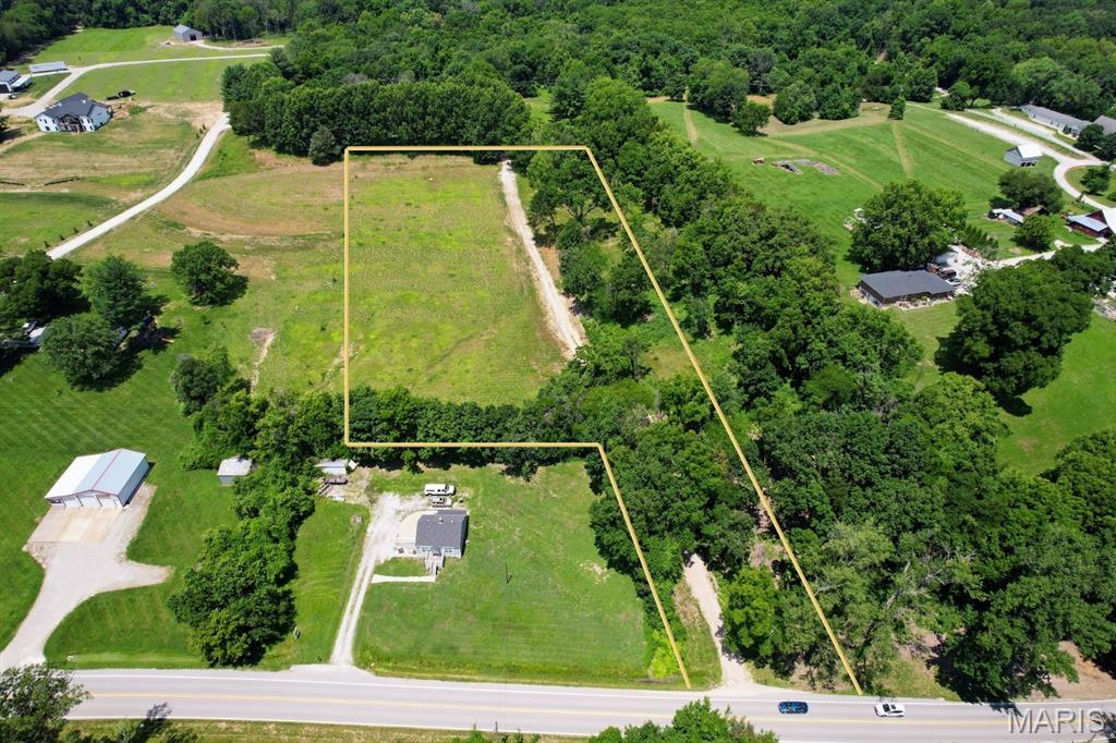 Rare opportunity to own 5.03 acres overlooking the Missouri River Valley just outside the heart of Defiance. Enjoy sweeping sunrise views, a private setting, and plenty of usable yard space for a custom home, outdoor living, gardens, or additional structures.

A private lane provides direct access to Hwy 94 while maintaining a peaceful setting. The existing clearing offers an excellent homesite with beautiful valley views and room to grow.

Located just outside downtown Defiance, you'll enjoy convenient access to the Katy Trail, local restaurants, community events, and the charm that makes this area one of St. Charles County's most desirable destinations.

Public water available and electric nearby. No HOA or subdivision restrictions. Fresh survey and soil evaluations available.