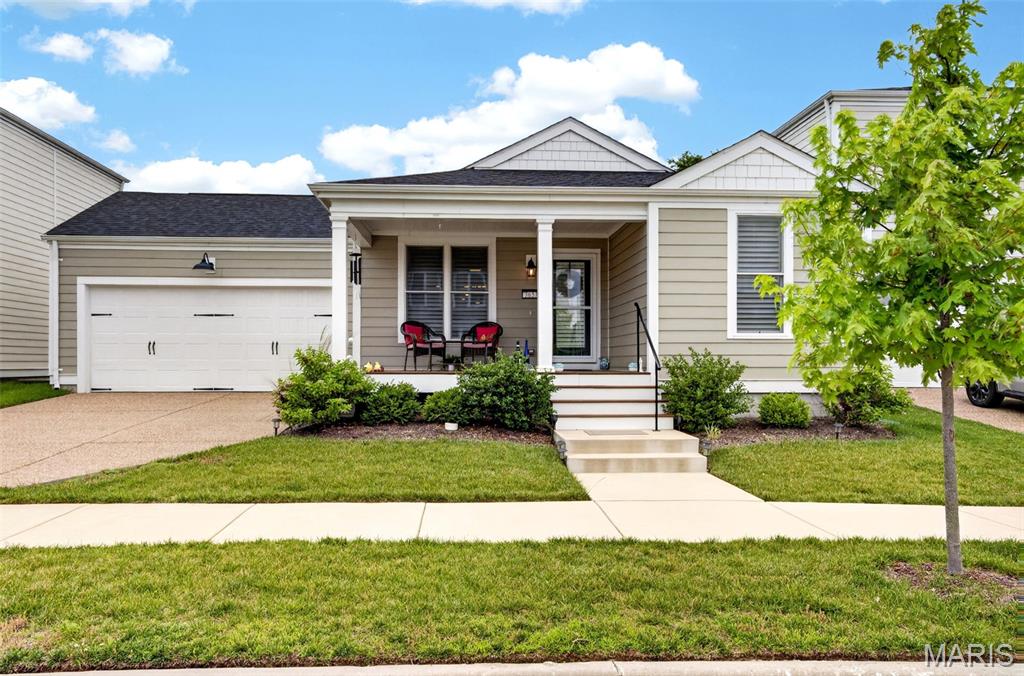 Welcome to Starkville Street, New Town! This Ranch Home is perfectly placed on a cul-de-sac street & is more than Move-In-Ready. Everything has been thought of for you! From the perfect covered porch entry to the spacious open living areas, move right in & start the summer off hot with all the community events & a beautiful new home. There are 3 bedrooms with the Primary Bedroom split from the 2 front bedrooms.  The primary is a GREAT size & includes your private bathroom with double vanities, soaking tub, large shower, and large walk-in closet.  The other 2 bedrooms are a comfortable size with their own spacious closets and a shared hallway bathroom.  The open kitchen is gorgeous with custom cabinetry, tons of storage, beautiful counter tops, & stainless steel appliances.  The large kitchen island has storage in the front & the back.  The living space is large enough to place your furnishings in so many ways! The backyard is a great size with a poured patio perfect for grilling & firepits. Gorgeous plantation shutters have been added throughout the home, along with upgraded custom storm/screen doors that let in the light & fresh air, but not the bugs.  Enjoy all the community amenities that Beautiful New Town has to offer! pool * lakes * concerts *  farmers markets & more! * Just in time for Summer!