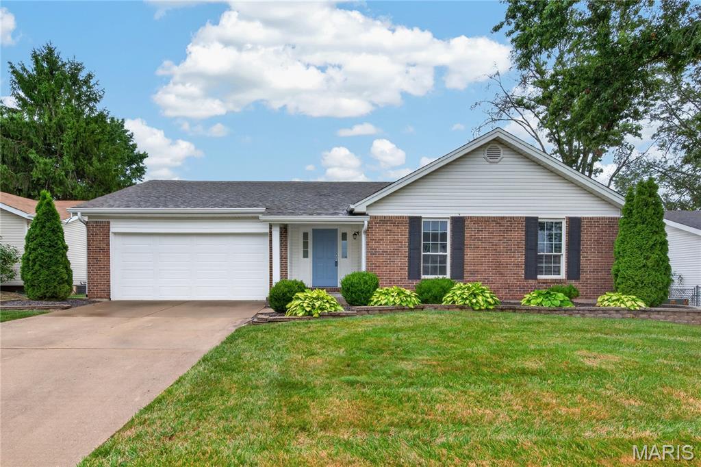 3 bedroom, 2 bath ranch with impressive finishes in a convenient St. Charles location!  This charming home offers approximately 1,916 sq ft of smart living space including the finished lower level.  The exterior is eye-catching with brick, enclosed fascia/soffits, vinyl siding, architectural shingles, a brick threshold at the front door and landscaping.  Features include an open floor plan, ceramic tile floors in the Kitchen-Breakfast Room-Bathrooms, vaulted ceilings in the Entry-Kitchen-Breakfast Room-Primary Bedroom-Primary Bathroom, stainless steel appliances, smooth top stove, microwave, dishwasher, refrigerator, washer, dryer, wood cabinetry with crown molding and soft close features, granite countertops, luxury vinyl plank flooring in the Great Room-Entry-Hallway, woodburning fireplace with brick to ceiling, ceiling fans, 2 closets in the Primary Bedroom, raised height vanity in the Primary Bath,  linen closet, shower and more.  The finished lower level has an Office, Family Room and Recreation area.  There is a sliding door that walks out from the Breakfast Room to a patio and level yard with playset and fencing. There is a 2 car garage with a garage door opener.  Students will attend desirable Francis Howell schools and there is easy access to Highway 94/364.  Excellent home, great finishes, check it out!