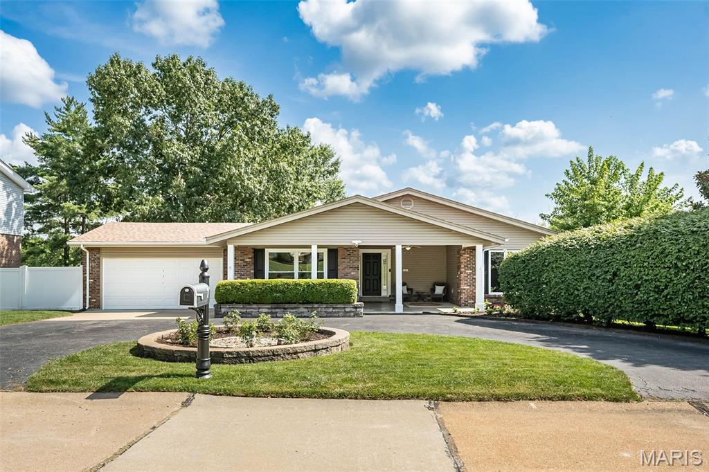Run don’t walk to see this 5 Bedroom 3 Full Bath mostly brick Ranch Style Home with over 3000 square feet of living space situated on a quiet Glan-Tai Subdivision cul-de-sac in Parkway West High School. You or your guests can park in the convenient circle drive which is also ideal for the household with abundant drivers. The spacious front porch welcomes you to the front door with leaded glass sidelights. As soon as you enter you will be wowed by the beautiful hickory wood floors in the entry, living room, dining room, hall and 3 main floor bedrooms. Enjoy the open floor plan which flows out to the very large deck ideal for morning coffee or entertaining or down to the finished lower level with family room, additional 2 bedrooms and bath. The chef of the house will enjoy prepping in the kitchen with stainless appliances including a GE Profile range new 6/26 with Convection and Air Fryer Features, center island with stainless hood, granite counters, deep double bowl sink with gooseneck pullout faucet, corner cabinet with Lazy Susan and a large pantry. The awesome huge Primary Suite boasts a sitting area with French Doors leading out to the deck and an 11 foot long walk-in closet. All baths have had some updates over time. Abundant recessed can lighting and updated fixtures. Architectural shingle roof new 2025. New carpet, lower-level bedrooms and stairs 2026. Interior freshly painted 2026. Fenced yard. Glan-Tai Subdivision amenities include lake with fountain, 2 pools, tennis court and basketball hoops.