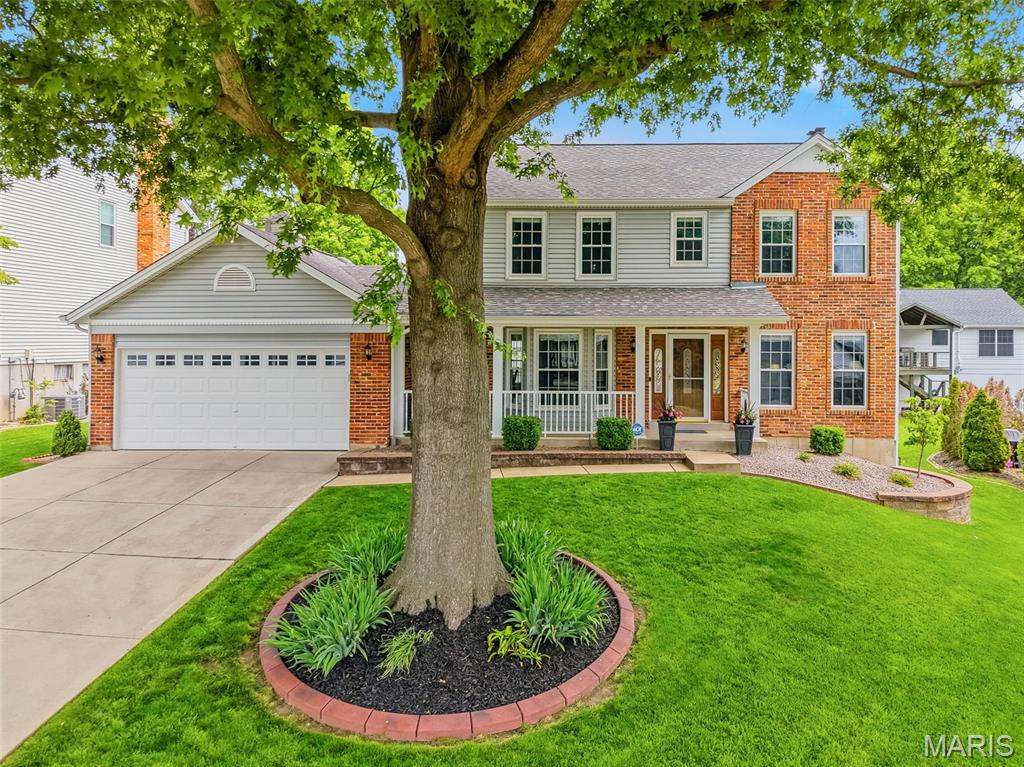 Welcome home to this beautifully updated and meticulously maintained 2-story home, showcasing timeless finishes and a neutral decor' throughout. The main level features hardwood flooring, a spacious family room with fireplace, formal dining room, and a versatile living room perfect for a home office or flex space. The updated kitchen blends style and function with granite countertops, refinished cabinetry, center island with cooktop, wall oven, microwave, and a bright breakfast room with patio access and fenced yard. The patio includes a frost wall already in place—ideal for a future sunroom addition. Main floor laundry offers cabinetry and utility sink, plus an oversized 2-car garage extended 2 feet on each side for extra storage and convenience. Upstairs, the spacious primary suite features a ceiling fan, generous closet space, and an updated bath with double bowl granite vanity, tile flooring, and separate tub and shower. Three additional bedrooms, all with ceiling fans, share a full bath with granite countertop and tile flooring. The full basement has a finished workshop room, two finished closets plus endless potential for future finish or abundant storage. Major updates include HVAC and water heater (2023), new roof (2016), replaced windows, refreshed landscaping (2025), irrigation system, security system, motion lighting, enclosed soffits and fascia, and gutter guards. The attractive brick front with vinyl siding adds curb appeal, while the desirable neighborhood offers stocked lakes and community activities. This move-in ready home truly has it all—just say “Yes to the Address” and begin making memories!