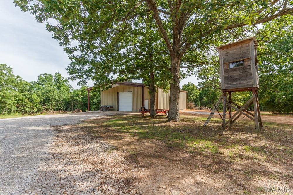 !!! 60 Acres Near Bennett Spring State Park – The Ultimate Outdoor Retreat !!!
If you've been searching for the perfect property to combine hunting, fishing, recreation, and future investment potential, this exceptional 60-acre tract just minutes from Bennett Spring State Park deserves your attention. Surrounded by the beauty of the Missouri Ozarks, this property offers outstanding opportunities for the outdoor enthusiast who wants a private getaway with room to roam and endless possibilities.
The land is heavily wooded, creating excellent habitat for wildlife and making it an ideal hunting property for deer, turkey, and other game. With world-class trout fishing at nearby Bennett Spring State Park, you'll enjoy the rare opportunity to own a property that caters to both hunting and fishing enthusiasts. A major highlight of the property is the impressive 45' x 50' shop building already in place. The building has been spray-foam insulated and includes a completed bathroom, providing a solid foundation for immediate use or future conversion into a comfortable cabin or lodge. Whether you're looking for a weekend retreat, hunting headquarters, or full-time residence, the possibilities are endless. Step outside and enjoy one of the property's most inviting features—a spacious 12-foot covered porch. It's the perfect place to relax after a day in the woods, enjoy your morning coffee, watch wildlife, or simply take in the peaceful surroundings and beauty of nature. Beyond personal recreation, this property offers tremendous development potential. Its location near one of Missouri's most popular outdoor destinations makes it an excellent candidate for an RV park, cabin rentals, glamping retreat, or other tourism-related ventures. With increasing demand for outdoor recreation and lodging near Bennett Spring, investors and entrepreneurs will appreciate the opportunities this acreage provides. Whether you're looking for a private hunting retreat, a place to build lasting family memories, or a property with income-producing potential, this remarkable 60-acre offering combines natural beauty, existing improvements, and unlimited possibilities in one outstanding package.