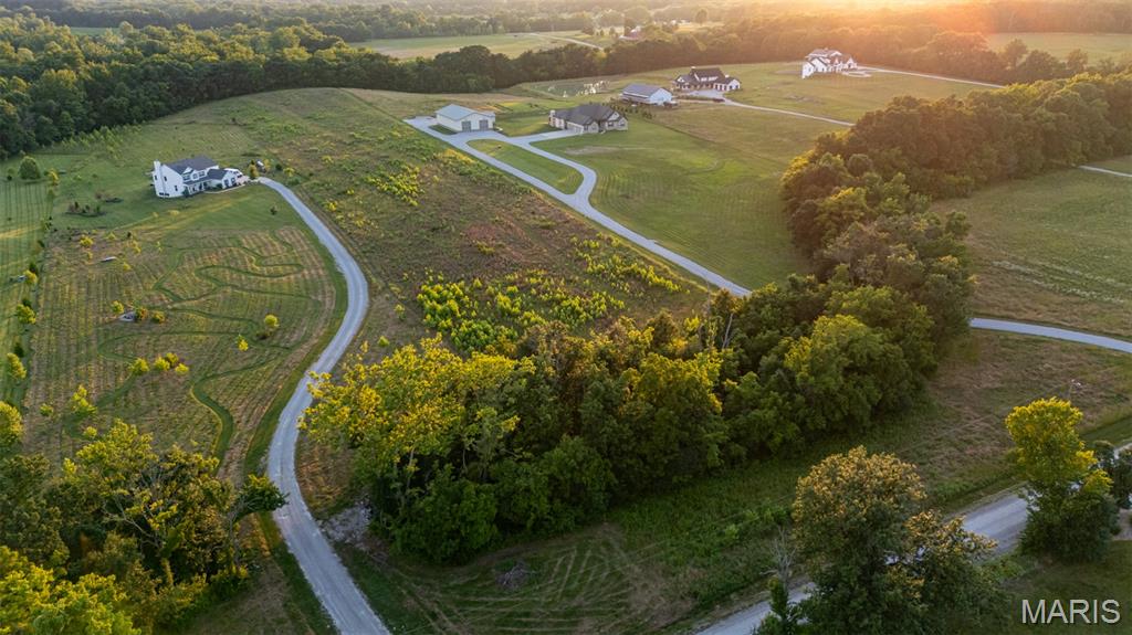 7.5 ACRES in WENTZVILLE!! Don’t miss this beautiful, rare find of 7.5 acres of cleared land ready to build your DREAM home. Just minutes from highway N, close to all major stores, NO RESTRICTIONS and NO HOA. This property has so much to offer, whether you are wanting a pasture for animals or space for a large garden. Some wooded land at the back of the property which has creek frontage (Dardenne Creek). Schedule your showing today and don’t miss the opportunity to build the country living dream, but just minutes from major stores.
