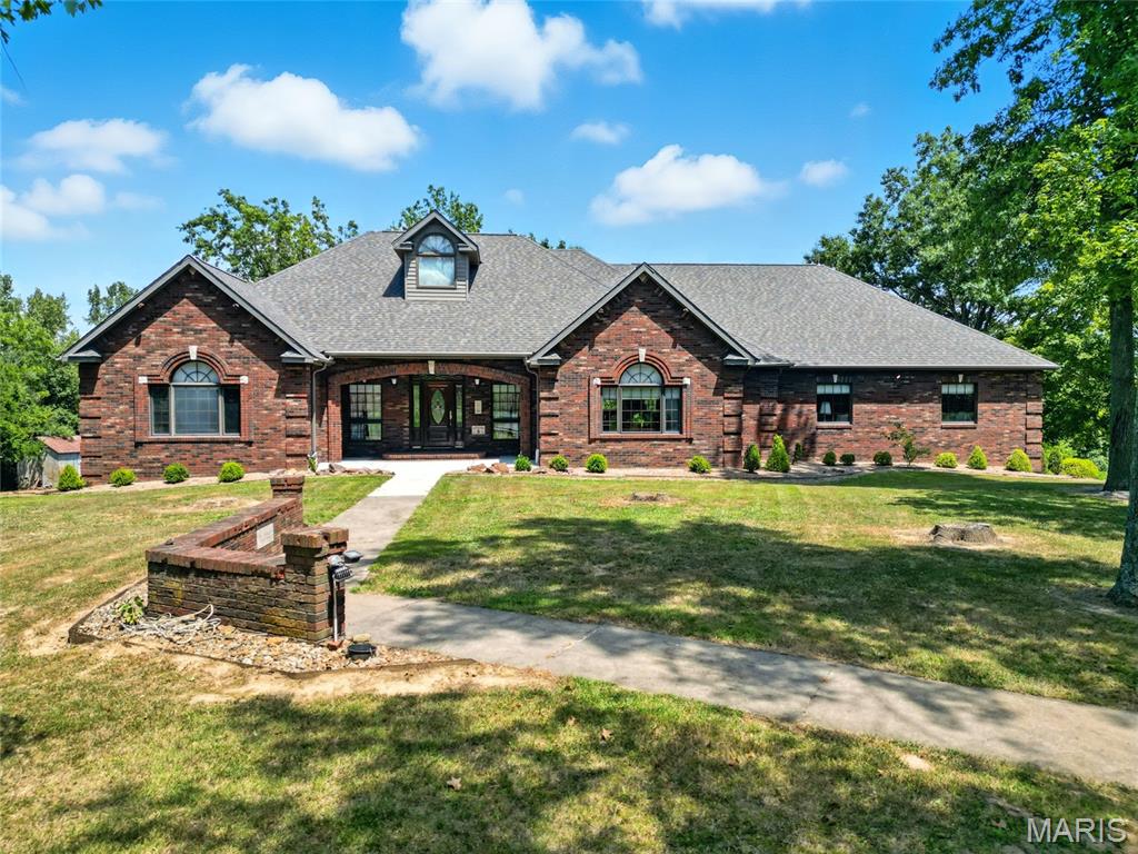 Back on the Market with a new look!  We have added a few virtually staged photos to highlight the unmatched craftsmanship & comfort that this custom built ranch provides. It offers over 6,000 sq ft of total living space surrounded by beautiful property (1.6 acres as listed or negotiate additional acreage up to a total of 10 acres). Main level offers 10-ft ceilings–some vaulted, 2x6 external walls, Pella windows, solid-core decorative wood doors with transoms & some sidelights, custom red oak cabinetry & built in bookcases/shelving (all reclaimed from a historic high school chemistry lab), pantry, main floor laundry, spacious dining area, breakfast room & 8-person breakfast bar. Features 4 BRs (4th w/o closet, armoires stay), 3 full baths, plus an additional rough in for lower-level bathroom & laundry. The potential for a second kitchen and a separate, zero step entry makes this home ideal for multi-generational living. Main-level gas fireplace & lower-level wood-burning fireplace/furnace for added heat source. Oversized, tandem 4-car garage is heated & cooled with 220 electric service. 4 HVAC units - high-efficiency gas furnace (2023) & geothermal, 800-ft well (pump 2021), central vac, water softener, attic fan and hot tub-ready hookup. The surroundings are beautiful with access to a large pond that’s fully stocked with fish. There is so much more, too numerous to mention - additional details available upon request. This beautiful home is in a peaceful rural setting close to both Chester IL & Perryville MO and an easy commute to Cape Girardeau, MO.  It blends luxury finishes, energy efficiency and country living—offering an ideal retreat for families, hobbyists, or those seeking an expansive forever home.  Seller is motivated, bring us an offer today!