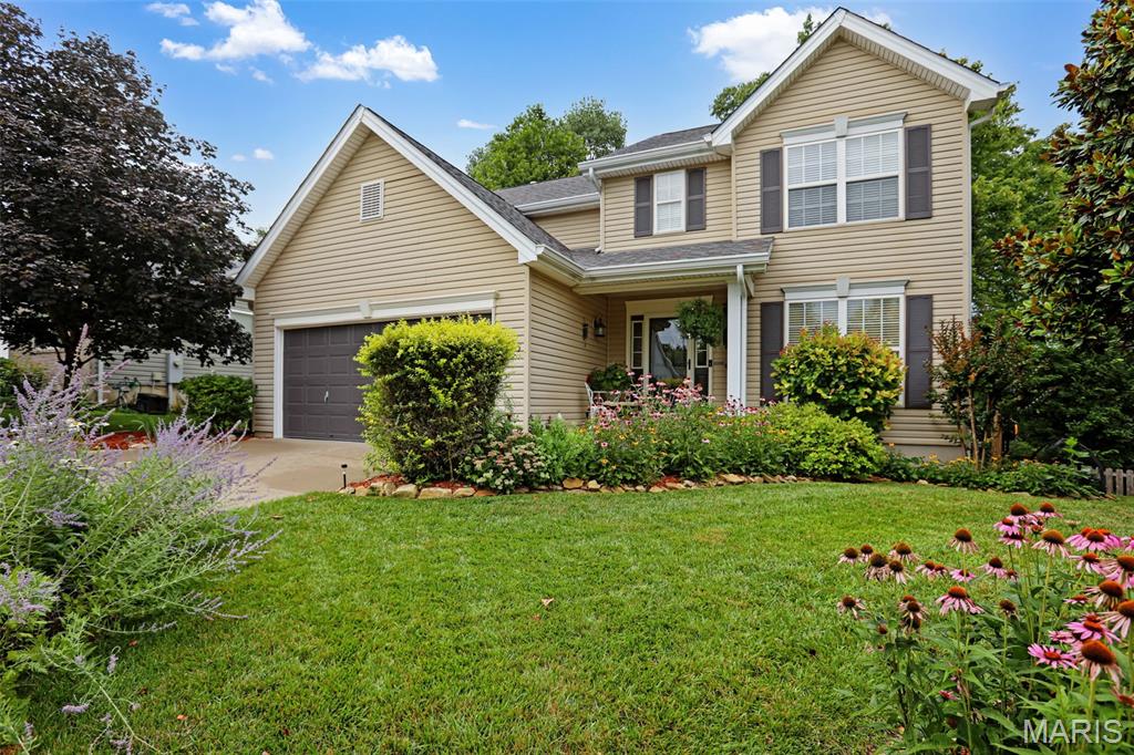 SPACIOUS AND GORGEOUS!! This 2 Story beauty is in the Estate of Eagle View subdivision that is near the quiet, low traffic at the end of the street. This home is over 2500 sq feet of living space with 4 bedrooms, 2.5 baths, on a lot with mature TREES and beautiful landscaping abound. The details begin from the moment you enter into the home. There is so much style and character with custom fluted molding, arched doorways, an open staircase, the den/office room with built-in bookshelves, special millwork, the spectacular windows that bring in so much light, the wainscoting, the updated LVP flooring and so much more. The kitchen features a huge butterfly island, black stainless steel appliances, breakfast area and a pantry. This space is made for your entertaining needs with open sightlines through the dining area and living room which boasts a welcoming fireplace to make everything cozy! You can't miss the beautiful staircase that emits prismed light from the custom decorative window in the stairwell. WOW! Upstairs you'll be treated to a private oasis of a primary suite with dual vanity, separate soaking tub, shower, and a massive walk-in closet! The upper level is completed by three more spacious bedrooms with each having their very own walk-in closet. The second bathroom does not disappoint with the newly updated tile shower! You'll love spending time outdoors where you are surrounded by nature with the mature trees and landscaping/flowers all around, you have the front porch area, the newly updated deck (14x14) out back or your large patio on the lower level. If you could possibly need any more space, your walkout Lower Level is ready and waiting for your personal finishing touches! Schedule your private showing TODAY!