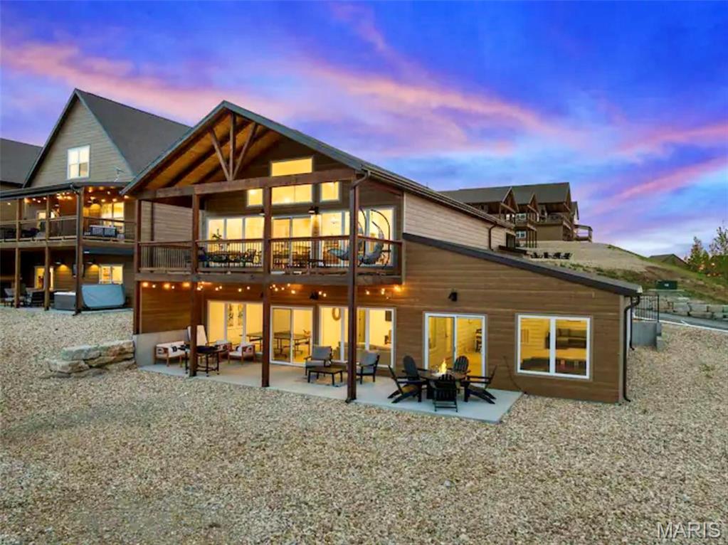 PRIVATE INDOOR POOL WITH TABLE ROCK VIEW! This immaculately furnished and decorated 5BR/7BA home features panoramic views of the Ozark Mountains and Table Rock Lake! Enjoy a glass of wine on the deck or patio or relax in the gorgeous indoor pool! This home has so much to offer! Granite countertops throughout, large sitting areas to accommodate multiple guests, just a few steps to all that Wilderness Mountain has to offer! The Lazy River is something you and your guests are sure to enjoy! Perfect for nightly rentals, this masterfully built home is only minutes away from Silver Dollar City and all that Branson has to offer. Vacation adventures are close by, and visitors will love returning to this calm, relaxing vista high above the lake for a peaceful stay. Located just a few feet from the primary amenity core, featuring an indoor pool, outdoor pool and a lazy river. Call today to set up your private showing! Suitable for Bed/Brk