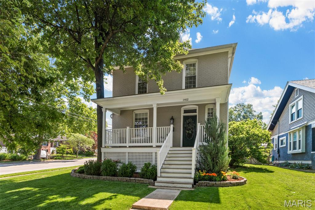 This is your chance to own a piece of St. Louis history! Welcome to 1402 Silverton Place, affectionately known as a “40 Thieves” home: one of 40 homes in Richmond Heights built with materials from the 1904 World’s Fair.

This impeccably maintained two-story home has all the historic charm you could want with incredible modern amenities, including an electric gate that opens to the backyard for additional privacy and security. Featuring 3 bedrooms and 2.5 baths, this residence showcases classic touches like gleaming wood floors, 9-foot ceilings, and original architectural details that create warmth and elegance throughout.

The main level features an inviting family room with a wood burning fireplace and a built-in bookcase with cabinets, perfect for additional storage and displaying decor that will allow you to infuse your personality into the space. A timeless curved archway leads you to the spacious separate dining room: the perfect place for hosting gatherings or enjoying everyday meals in style. The updated kitchen features sleek stainless steel appliances, white subway tile, luxury vinyl plank flooring, and contemporary finishes that make cooking and entertaining effortless.

Upstairs, you’ll find two comfortable, light-filled bedrooms, a full bathroom, and the serene primary suite. All three bedrooms have custom organization systems in the closets thoughtfully installed. The primary suite features a stunning fireplace with tile detail, its own full bathroom and a walk-in closet.

Outside, enjoy a fully fenced backyard complete with an electric gate and a detached two-car garage—ideal for pets, play, gardening, or relaxing in your own private outdoor space.

This unique home beautifully combines historic elegance with today’s most desired updates—offering the character you love with the conveniences you need. Don’t miss the opportunity to make this beautiful home yours!