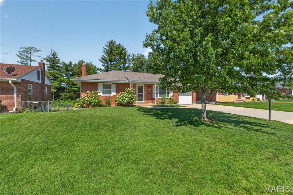 Welcome to 10025 Shapfield Lane, a timeless brick ranch that stands out for its extensive, high-quality updates, smart use of space, and elevated exterior. Inside, wood floors flow through much of the main floor, where you’ll find three bedrooms, an updated full bath, and a living room with large windows that fill the space with abundant natural light. The kitchen, renovated in 2021, showcases premium countertops and cabinetry, stainless steel appliances, a pantry, and convenient access to the attached garage. The partially finished basement not only provides ample storage but is the spot to entertain, offering new carpet, a full renovated bath, and a walk-out to the fenced yard and patio. Backing to woods, you can enjoy a private setting with usable outdoor space and a newer concrete patio which extends the living area (umbrella included!). The brand-new charming shed boasts a loft and adds excellent storage! The sellers have made significant investments behind the scenes, including newer windows & driveway, an upgraded electrical panel with whole-home surge protection, an insulated garage door, updated siding and gutters, PLUS a new roof & decking. The HVAC system is also a major highlight, featuring a top-of-the-line Lennox system. Set on a quiet, picturesque street in a convenient location - this home has so much to appreciate! Tour today!