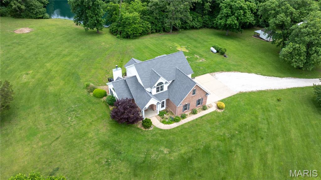 **RARE OPPORTUNITY ASSUMABLE 2.875% MORTGAGE! Welcome to 9 Buelah Drive — the kind of property that rarely comes available in Troy. Set on 15 unrestricted acres with a stocked pond, abundant wildlife, and peaceful views in every direction, this property offers the privacy and space so many buyers are searching for.

This beautiful 4-bedroom, 4-bath home was designed for both comfortable everyday living and entertaining. Inside, you’ll find spacious living areas filled with natural light, tall ceilings, and charming details throughout that make the home feel warm and inviting. The kitchen opens seamlessly into the main living space and features a large walk-in pantry, while the finished walk-out lower level includes the perfect office or flex space for working from home. The home also features a private sauna, creating the perfect place to relax and unwind after a long day.

Outside is where this property truly shines. Enjoy quiet mornings on the oversized back deck overlooking the pond and acreage, spend evenings fishing, exploring the land, or simply taking in the peaceful setting. The outbuilding offers endless possibilities for storage, hobbies, equipment, or workshop space, and the chicken coop with electric adds even more character and functionality to the property.

Whether you’re looking for room to spread out, space for animals or hobbies, or simply a private retreat away from the hustle and bustle, 9 Buelah Drive offers a lifestyle that’s hard to find. With no restrictions and endless potential, this is more than just a home — it’s your own slice of country paradise. Agent Owned