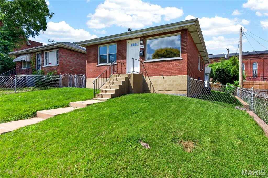 Rare opportunity in the heart of Soulard! 905 Russell Blvd is a beautifully rehabbed 2-bed, 2-bath that delivers what almost never comes available here — a true traditional single-family home with a detached 2-car garage and private fenced yard. The main level lives easy: updated kitchen, separate dining room, living room, two bedrooms, and a full bath, all on one floor. Downstairs, the fully finished basement is a showstopper, featuring LVP flooring, recessed lighting, infinity ceiling, and a second full bath — perfect as a media room, office, or second living room. Steps from the historic Soulard Farmers Market and Russell Blvd's best dining and nightlife, with the Anheuser-Busch Brewery, downtown, and highway access all minutes away. Historic charm, modern finishes, garage parking, and a yard in one of St. Louis's most beloved neighborhoods. Homes like this don't last — schedule your showing today! Agent has ownership interest in the property.