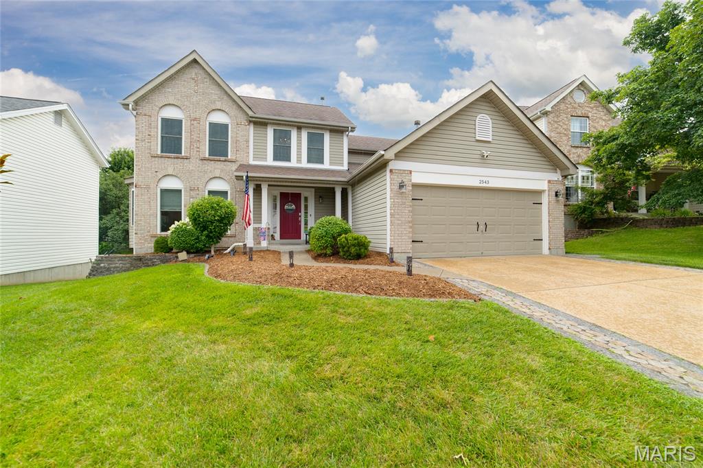 Beautifully updated 2-story home featuring 4 bedrooms, 2.5 baths, and a finished walkout lower level! The custom kitchen opens to the spacious family room with a gas fireplace, creating the perfect gathering space. Luxury vinyl plank flooring adds style and durability throughout the main living areas. The finished lower level offers a large game room plus a 5th bedroom, ideal for guests, a home office, or additional living space. Retreat to the primary suite featuring a private bath with double sinks and a large soaking tub. Enjoy outdoor living on the expansive deck overlooking the private fenced backyard, or relax on the covered patio below. Additional highlights include main floor laundry, oversized garage and new windows installed in 2023. With generous living spaces, thoughtful updates, and fantastic indoor-outdoor living, this home is ready for its next owner!