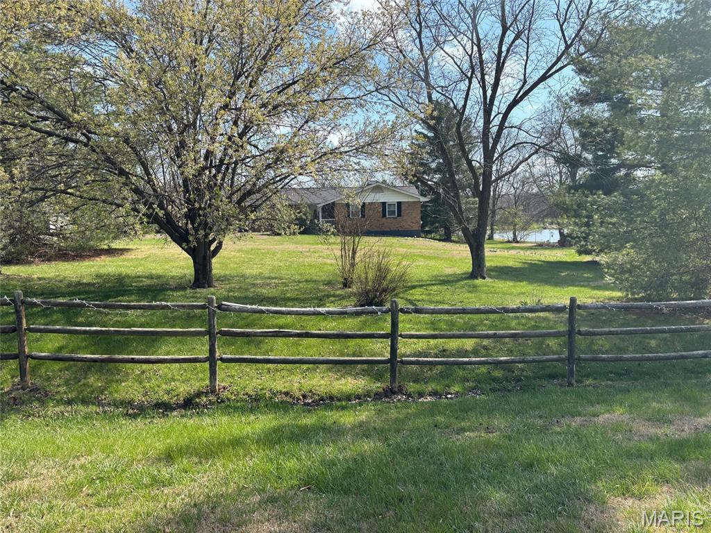 HUGE PRICE REDUCTION!!! MOTIVATED SELLER!!!

Private Ranch Retreat on Nearly 1 Acre with Scenic Water View 

Just minutes from Pacific, this beautifully maintained spacious 3-bedroom, 2-bath ranch home on nearly one acre offers a rare combination of space, privacy, and convenience. Nestled on a generous corner lot surrounded by mature trees and thoughtful landscaping, this property feels like a peaceful retreat while still being close to shopping, dining, and the highly regarded Meramec Valley R-III School District.

Step inside to discover a light-filled open floor plan designed for both everyday comfort and effortless entertaining. A formal dining space flows seamlessly into the welcoming family room, where a cozy wood-burning fireplace creates the perfect gathering place for relaxing evenings or hosting friends and family.

The bright and functional kitchen features warm wood cabinetry, generous counter space, pantry storage, and a breakfast bar, along with stainless steel appliances including an electric range,  dishwasher (installation scheduled) and refrigerator.

One of the home’s most inviting features is the charming three-season sunroom, where you can enjoy morning coffee or unwind in the evenings while taking in peaceful water views and nature-filled surroundings. Just outside, the extended patio creates an ideal setting for outdoor dining, entertaining, or simply enjoying the changing seasons in your own backyard oasis.

The primary suite offers a comfortable private retreat with an adjoining bath and shower, while two additional bedrooms and a full hall bath provide flexibility for family, guests, or a home office.

The partially finished walk-out basement expands the living space with room for a recreation area, media room, or game lounge, along with a dedicated laundry area and abundant storage.

Additional highlights include:

• Full brick exterior for timeless durability

• Oversized 24 x 22 two-car side-entry garage

• Extended aggregate driveway and walkway

• Storage shed included

.  New flooring on main floor 2026  

• Nearly one acre corner lot offering privacy and space

Homes offering this much land, privacy, and scenic surroundings rarely become available this close to Pacific, making this a unique opportunity for buyers seeking a peaceful lifestyle with modern convenience.

You won't want to miss this GEM! Schedule your showing appointment today!

Seller prefers to sell "As Is".