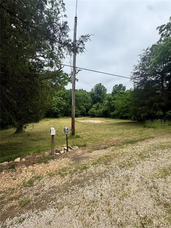 Beautiful .92-acre property consisting of two parcels 18-6.0-14.00-000-000-006.00 and 18-6.0-14.00-000-000-005.00 at 8190 State Highway 21 S. The land features electric , a city water tap in on property, septic, and two existing concrete foundations. A spring-fed creek runs through the property year-round, adding natural beauty and a peaceful setting. This property offers a great opportunity for a future homesite, recreational retreat, or investment.