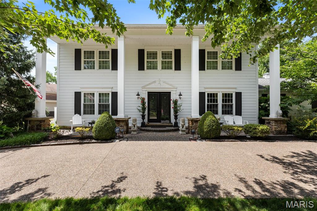 Stunning 5-Bedroom Colonial in Chesterfield Valley

This beautifully transformed Colonial home offers 5 spacious bedrooms and 3.5 bathrooms, perfectly designed for comfort and style. The inviting covered front porch features elegant wood columns and paver stonework, complemented by seasonal landscaping that enhances the curb appeal.

The exterior boasts a striking aggregate 1/2circle driveway and an additional side driveway leading into the 2 car attached side garage. An entertainer’s dream backyard with a Baker Pebble Tech pool and water fountain feature, meticulously maintained by Baker Pool since 2012. Surrounding the pool is a gorgeous paver patio with custom outdoor lighting, a built-in gas grill, fire pit, backyard speakers, and irrigation to keep the lush landscaping vibrant year-round.

Crafted with quality and durability in mind, the home features James Hardie siding, Berry Door and Window energy-efficient Soft-lite Imperial LS vinyl windows with Low-E glass that tilt for easy cleaning. Glass block basement windows add both security and style.

Inside, you’ll find hardwood floors throughout the living and dining rooms and upstairs bedrooms. The tiled entryway leads you to the tiled family room and kitchen. The family room focal points featuring a custom fireplace mantle that has been upgraded to gas for ease and year-round enjoyment with a custom dry bar featuring granite, display/storage cabinet with lighting  to showcase the space (Marc Christian Fine Cabinetry). 
The kitchen is a chef’s dream with a custom  island, newer refrigerator with double doors, meat/cheese drawer, lower freezer and ice maker. A new dishwasher completes the kitchen overlooking the gorgeous pool and landscaped backyard. You’ll find more custom (MCFC)in the laundry room/full bathroom. An added bonus for the chef is a custom spice cabinet. The full bathroom with custom vanity and medicine cabinet adds more storage space while providing flexibility and privacy for the main floor guest bedroom, currently being used as an office. 

The finished basement is perfect for entertaining, complete with a dedicated entertainment room and a separate kitchen area equipped with a refrigerator, microwave, sink, and kitchen cabinets with 
ample storage. 

Experience the perfect blend of luxury, functionality, and timeless appeal in this exceptional Chesterfield Valley home.