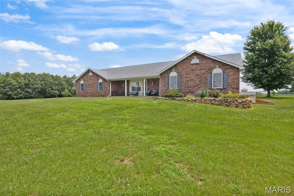 Welcome to your serene country living in this beautiful ranch home sitting on 3 quiet acres. Thoughtfully designed for easy living and entertaining, this home showcases an open-concept layout with hardwood floors throughout the main living areas and four main-floor bedrooms—ideal for guests, family, or a dedicated home office.

Spacious great room flows into the dining area and a bright, well-appointed kitchen—perfect for everyday life and gatherings.
4 bedrooms on the main level, including a comfortable primary suite.
2.5 bathrooms on the main floor, plus a full bath in the finished basement for added convenience.
Oversized 3-car side-entry garage provides great curb appeal and extra storage.
Full basement offers flexible space for a media room, gym, hobby area, or playroom.

Car enthusiasts, hobbyists, and small-business owners will love the detached, climate-controlled shop—complete with a car lift—offering true turnkey utility for projects, storage, or a studio.

Outside, enjoy wide-open skies, mature trees, and room to roam—bring your garden plans, pets, and weekend toys. The private, country setting feels miles away yet keeps you within an easy drive of everyday essentials.