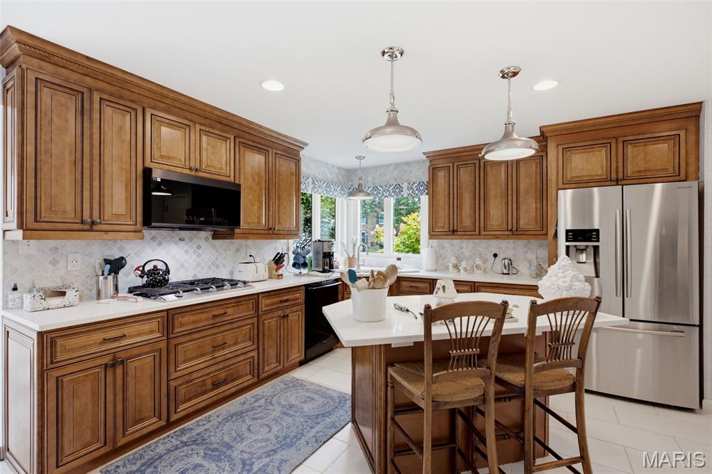 4701 Idecker Place, St. Louis, MO 63129 is a 4-bedroom, 4-bath brick home with 2,749 square feet on a quiet cul-de-sac, offering timeless quality, generous living space, and thoughtful updates throughout. Meticulously maintained by the same family for more than 25 years, this home showcases craftsmanship and care that stands the test of time, with high-quality finishes and a floor plan designed for everyday living and entertaining.

The kitchen features custom cabinetry, granite countertops, stainless steel appliances, abundant storage, and a backyard view that keeps the heart of the home connected to outdoor living. The spacious living room is filled with natural light from floor-to-ceiling windows and centers around a gas fireplace. Upstairs, the primary suite includes a walk-in closet with a custom organization system and a beautifully updated ensuite bath designed as a relaxing retreat. Three additional bedrooms and an updated hall bathroom complete the second level, providing flexible space for guests, home offices, or hobbies.

The finished lower level expands the living space with a full bar, dedicated pool table area, separate media and recreation space, and an additional full bathroom, creating an ideal setting for gatherings of any size. A side-entry two-car garage adds convenient access and extra storage.

Located on Idecker Place in St. Louis, Missouri 63129, this property combines the privacy of a cul-de-sac with convenient access to shopping, restaurants, parks, and everyday amenities throughout South County. Homes on Idecker Place are rarely available, and this well-maintained residence offers the opportunity to personalize cosmetic style over time while enjoying quality construction, exceptional space, and major features already in place.
