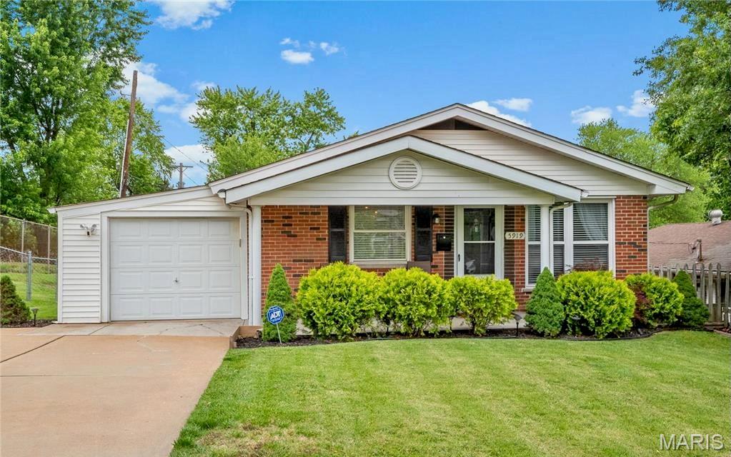 Looking for a move-in-ready ranch with extra living space, major updates, and an unbeatable Affton location? This beautifully maintained all-brick home offers the perfect combination of comfort, functionality, and peace of mind. The main level features beautiful hardwood floors, abundant natural light from oversized front windows, and a welcoming layout with three bedrooms and 1.5 baths. The primary bedroom includes a convenient private half bath enhanced with stylish shiplap accents, while the updated full hall bath serves the remaining bedrooms. The kitchen is thoughtfully designed with custom cabinetry featuring pull-out shelving, stainless steel appliances, under-cabinet lighting, and a stainless steel backsplash that blends style with everyday functionality. The finished lower level greatly expands the home’s versatility with a spacious family room, full bathroom, and a legal fourth bedroom complete with a newly installed egress window—perfect for guests, a home office, or multi-generational living. The dry lower level also offers excellent storage and a laundry area with a utility sink.
Outside, you’ll appreciate the fully fenced backyard, side patio with updated railing and shade sail, native low-maintenance landscaping, and a permaculture-inspired garden. The oversized driveway provides exceptional parking. Major improvements provide added confidence, including a brand-new roof (2025), high-efficiency RunTru by Trane furnace and central air (2024), and numerous thoughtful updates throughout. Situated on a quiet corner lot with added privacy, this home is just minutes from Matilda Park, scenic walking paths, 9 Mile Garden, shopping, dining, and everything Affton has to offer.