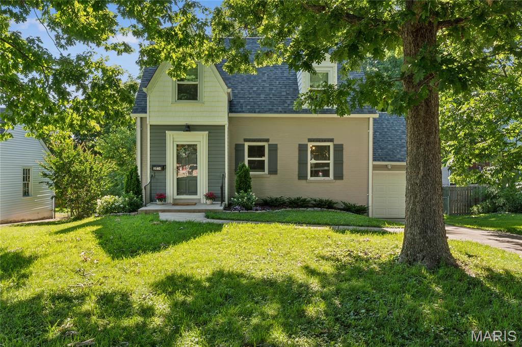 Welcome to 1034 Bernice — a bright, beautifully maintained Cape Cod in the heart of Kirkwood, where classic architecture meets thoughtful updates.

Step inside to a foyer framed by a striking Moorish arch — the first of several throughout the home — setting a tone of character and craftsmanship that carries through every room. Custom wood-built storage cubbies keep daily life organized before you enter the open living room, where original hardwood floors, a decorative wood-burning fireplace, and crown molding reward the eye at every turn. A separate dining room flows into a well-appointed kitchen with 36" maple cabinetry, granite countertops, stainless appliances, recessed lighting, and an arts and crafts inspired tile backsplash — a genuinely functional space that handles everything from weeknight dinners to full holiday hosting.

The screened porch is a true retreat: warm-paneled walls and wood floors bring the ambiance to make it a room you'll use well beyond summer. Peaceful backyard views, a fenced yard with patio, and one-car attached garage complete the outdoor picture.

Upstairs, two generously sized bedrooms feature dormer alcoves and walk-in closets, anchored by a beautifully remodeled full bath with a tub/shower combo, floor-to-ceiling vertical subway tile surround, marble vanity top, and polished nickel fixtures — clean, timeless, and done right. 

The lower level handles all your laundry, storage, and hobby needs with room to spare. Two blocks from highly-rated Tillman Elementary, with easy access to Kirkwood's shops, restaurants, and commuter routes. A home with genuine personality — and the updates to back it up.