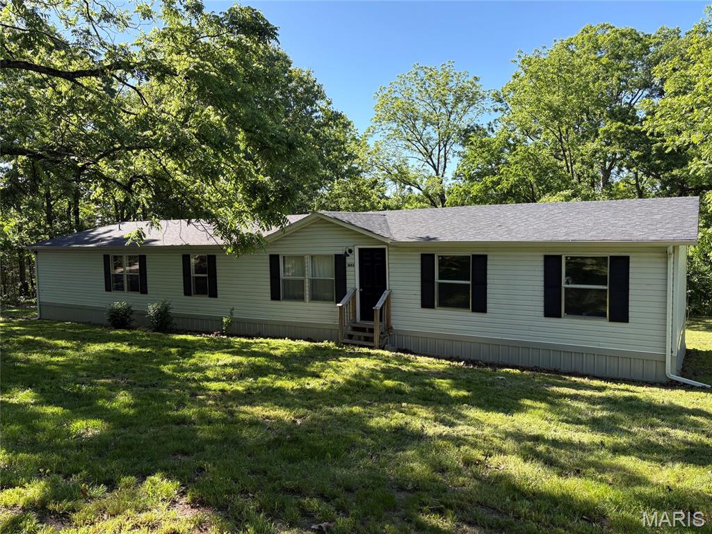 Stunning 4 bed 2 bath manufactured home on 4.13 Unrestricted Acres just outside of Hermann. This spacious home boasts recent updates that include flooring, paint, carpet, skirting, and a deck all within the last 3 years. The layout of the home offers you endless opportunities to utilize the oversized living room, kitchen, and dining area. The home is a split bedroom design with the master bed/bath and large additional office room on one side, and the remaining bedrooms and bath on the other. The property is very private and borders several large tracts of land, adding a nice sense of privacy, while still being located right off black top. For the hunters, there is an established food plot area where several nice deer and turkey have been taken off of this property the last few years. Whether you are looking for your first home or your forever home. This property is one you don't want to miss!