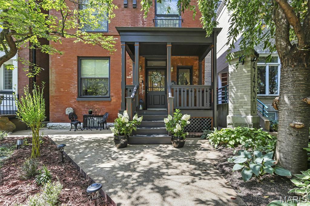 OPEN SUNDAY 1-3PM | Historic character with modern convenience & luxury - this one of a kind home features a four stop elevator, a universal design kitchen, pocket doors, historic millwork, a great room with cathedral ceilings and so much more! Beautiful front curb appeal, as you walk up to the covered front porch from the quiet semi-private street with private resident parking. Entrance foyer with a charming, historic staircase, gorgeous hardwood flooring and tall ceilings welcome you to the inside of this home. Front living room with a fireplace and pocket doors connecting you to the separate dining room. Huge kitchen - a chef's dream! All stainless steel appliances, stunning  Cambria quartz counters, a large amount of universally designed cabinetry (allowing base cabinet doors and floors to be easily removed/replaced under sinks and cooktop - in the event owner requires pull under space to use them) double sink, two dishwashers, wall oven, a second oven and built-in fridge & separate freezer. Adjustable height buffet counter between oven and wine fridge. Large center island with an additional sink, bar style, overlooking the great room with roaring cathedral ceiling and tons of natural sunlight. This is the perfect room to host any friend gathering or family event. Grand is an understatement - you have to see it yourself! Main floor also features a large half bath with universal base cabinet & closet / pantry space. Mud room in the back as you walk outside to your private backyard - fully fenced, a backyard oasis with gardening beds, a ramp for accessibility and a gazebo. Rare convenience - private, oversized two-car garage with additional room for storage. Back inside - use the historic staircase or the elevator up to the second floor where you'll find two spacious bedrooms, a laundry area, a full bath AND the primary suite. The fully functioning elevator serves all four floors. Wide spiral staircase leading you to the third floor of this home - could be it's own private primary suite! Featuring a full bath, walk-in closet and bedroom. Lower level has been partially finished and could also function as mother-in-law's suite - sleeping room, kitchenette area, full bath, and another laundry space. Sophistication & thoughtful finishes throughout - every detail was created to provide comfort, convenience, and mobility without compromising on style. Outstanding location! In the heart of Central West End nestled on a picturesque tree-lined & landscaped semi-private street in Laclede Place - walkable to iconic restaurants, lunch spots & bars, nearby boutique shopping, walk to Forest Park, BJC & WashU. Close to everything St Louis has to offer. This one is a MUST SEE - hurry, won't last long!