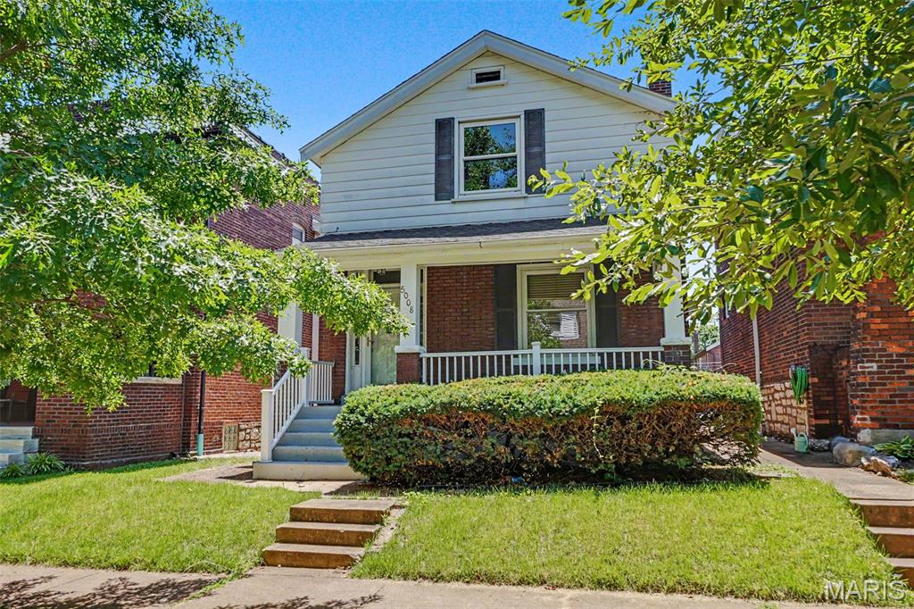 Charming South City Craftsman's Style home updated through out. This is a must see property that will be a perfect option for first time home buyers, down sizing or investors. Conveniently located close to the South Kingshighway commercial development with trendy restaurants and coffee shops. Inside you will find an inviting open floor plan with a light filled living room and dining room, large windows and hardwood flooring. The updated kitchen features stainless steel appliances including  refrigerator, gas range, microwave, dishwasher, wood cabinets, butcher block counter tops and tile backsplash. Upstairs there are two generous sized bedrooms with spacious closets and wood flooring. The hall bathroom has been updated with tile flooring, bead board paneling and white cabinetry. The lower level features a "period style" dry bar, vintage refrigerator, half bathroom and plenty of extra storage.  Outside there's an expansive deck overlooking a fenced in rear yard and a detached garage. Recent system updates include new roof 2026, new water heater 2026, sewer lateral and stack repaired 2026, new wood flooring 2025. The home is move in ready and available for immediate occupancy.