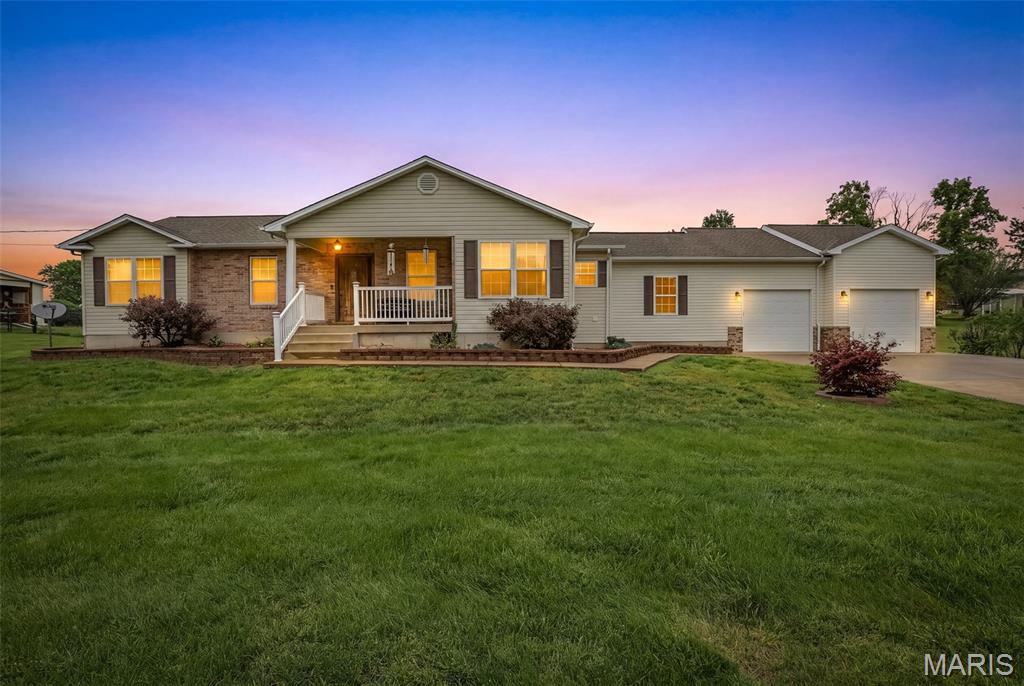 This is the home you've been waiting for!! Located in a charming neighborhood in Desloge, this 3 bedroom, 2 1/2 bath home is just minutes from everything you need while providing a quiet, peaceful oasis of your own!  Step inside to discover an open floor plan with hardwood and laminate flooring.  A hand-crafted brick/stone propane fireplace provides added beauty and an additional source of heat during those cold winter months.  The kitchen boasts exquisite granite countertops, modern updated appliances, a beautiful island/breakfast bar and plenty of cabinet space!  Whether you enjoy soaking in a hot tub or taking a shower, you can have the conveniences of both with your tankless hot water heater!  The master bathroom is equipped with a walk-in shower and a jacuzzi tub that is calling your name!  The second bathroom has a beautiful freestanding tub with an attached shower head.  Needing a place for a workshop or maybe just some extra storage?  This expansive garage has it! There is ample space for parking vehicles (as well as a boat, SxS, golf cart - whatever the need may be), utilizing a work bench area, AND providing additional storage.  Escape outdoors to your fenced backyard to enjoy the secure, tranquil retreat awaiting you.  The covered patio is a versatile addition, perfect for relaxing, dining or entertaining, regardless of the weather.  But the true gem of the backyard is your sparkling above-ground pool, providing a sanctuary of relaxation at home!  Summer has just begun so there is still plenty of time to enjoy a cool refreshing dip in the pool after a long day.  Don't miss out on this one - call today to visit your new home!