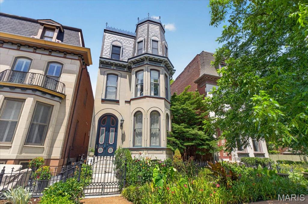 Available for the first time in 20 years, 2011 Park offers a rare chance to own a beautifully preserved 1885 Victorian Mansard roof home in Lafayette Square. Set directly across from Lafayette Park, this 5 bedroom, 3.5 bath residence blends historic character with comfortable everyday living. Tall ceilings, abundant windows, and natural light create an inviting feel throughout. Period appropriate details honor its 19th-century roots, while thoughtful features add modern function. The kitchen enjoys a charming view of the scenic rooftop garden above the garage, a quiet retreat in the city. An oversized two-car full brick garage includes a lift for a third car, adding rare parking or storage flexibility. Solar panels on the house add an energy feature. Moments from neighborhood restaurants, shops, and Lafayette Park, this is a special opportunity in one of Saint Louis’ most treasured historic settings.