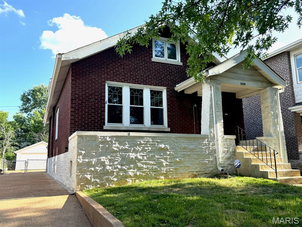 Don't let this opportunity pass you by!  Check out this full-brick / stone home today.  The main floor has 9 ft ceilings & has been rehabbed. New kitchen includes soft close cabinets, new stainless-steel appliances, wine rack, wide sink w/ cutting board inserts, gas stove w/ range hood, upper glass cabinets w/ dimmable lights, granite counter top & center island. Dining room accesses a new 10' x 16' arbor covered composite deck via new French doors and a coat/pantry closet. Master bedroom includes a large sliding barndoor closet, ceiling light w/retractable fan, and an ensuite bathroom w/ lighted/defogger mirror. Guest bedroom has two closets. Guest full bath includes a lighted/defogger mirror & shower/tub. Family room includes a brick decorative fireplace w/ book cases, pre-wired speaker outlets, coat closet, a stained-glass classic charm window and a ceiling light w/retractable fan.  Upper level has arched ceilings, 2 rooms and a closet with wood and faux wood floors.
All plumbing is new, including the connection to the City Water supply (in street).  New hot water heater and electric.  Private driveway off of Bancroft which leads to a fenced backyard and a 2-car garage. Never have to worry about parking.  Walking distance to great restaurants (Russell's on Macklind, Clementine's Creamery, etc.)