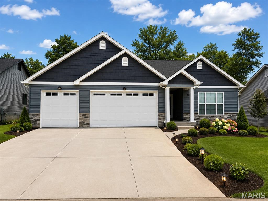 Built in June 2025 and originally purchased for $432,000, this exceptional ranch home offers a rare opportunity to own a nearly new, move-in-ready property in the highly sought-after Kensington Ridge subdivision at a price below market value. Designed for modern living, the open-concept floor plan features soaring vaulted ceilings, rich hardwood flooring, and a chef-inspired kitchen with stone countertops and an oversized island perfect for gathering and entertaining. The luxurious primary bath showcases double vanities and a spacious walk-in shower, creating a relaxing spa-like retreat. Additional highlights include a full basement, an attached 3-car garage with an 8-foot door, and a covered patio ideal for outdoor dining and entertaining. With its blend of quality craftsmanship, stylish finishes, and exceptional value, this home presents an outstanding opportunity for buyers seeking comfort, convenience, and modern elegance.