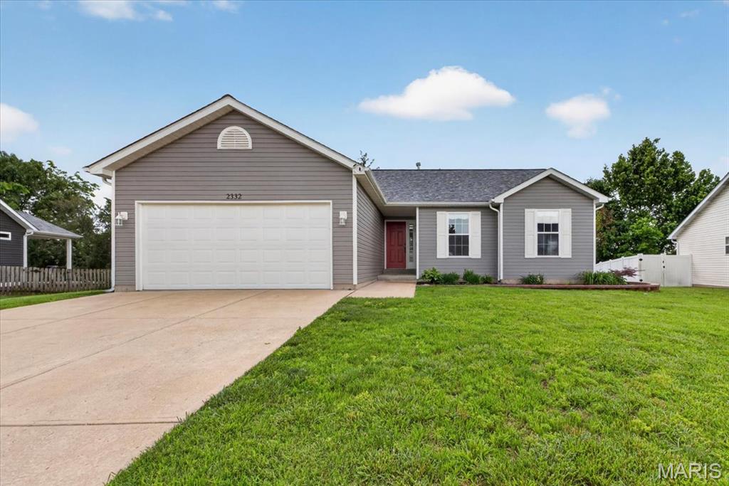 Welcome to this STUNNING ranch-style home in the desirable West Ridge subdivision, where eye-catching curb appeal and beautiful landscaping make an unforgettable first impression. Step inside to a welcoming foyer featuring updated luxury vinyl plank flooring that flows seamlessly throughout the main level. The vaulted ceiling enhances the bright, open living room, complete with a gas fireplace—perfect for relaxing or entertaining.
The living space transitions effortlessly into the beautifully updated kitchen and dining area, highlighted by a charming bay window with a sliding door leading to the backyard. The kitchen features newer quartz countertops, updated backsplash, a large under mount sink, updated cabinetry, and stainless steel appliances, creating a modern and functional space for everyday living. Convenient access to the main-floor laundry room and attached two-car garage adds to the home’s practicality. The main level is anchored by a spacious primary suite offering a walk-in closet and private full bath with a soaking tub. Two additional spacious bedrooms and a full hall bath complete the floor plan. Step outside to enjoy the peaceful backyard, which backs to trees for added privacy and features a deck ideal for entertaining or unwinding. This home truly has it all—style, comfort, and convenience. Welcome HOME!