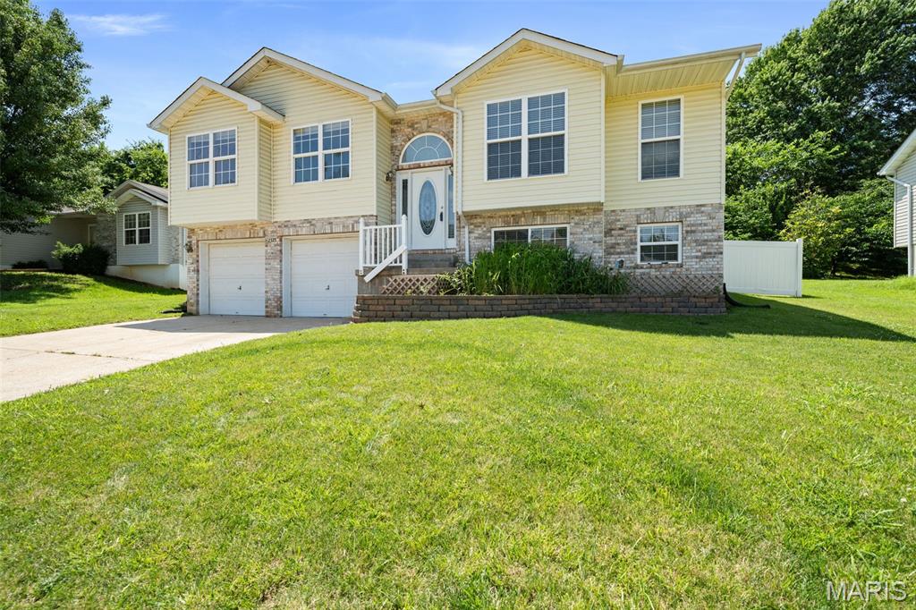 Welcome home to 2325 Arkansas Dr! This impeccably maintained 3 bedroom, 2.5 bath home offers an inviting open floor plan with over 1700 sq ft of living space, vaulted ceilings, abundant natural light, and a spacious layout designed for everyday living and entertaining. From fresh interior finishes and brand new carpet to a recently added paver patio, pergola, and maintenance-free deck, this house has it all! Tons of natural light throughout the living area flows into the kitchen and dining rooms, while the finished lower level provides additional living space perfect for a family room, home office, workout area, or recreation room.

Step outside and enjoy your own backyard retreat. The recently installed paver patio and pergola create the perfect setting for relaxing evenings, outdoor dining, and entertaining guests. The backyard fencing and deck have been upgraded with maintenance free materials, allowing you to spend more time enjoying the outdoors and less time on upkeep. Additional features include a 2 car garage, lower level half bath, ample storage, and convenient access to shopping, dining, parks, and major commuter routes.

With stylish updates already completed and exceptional outdoor living spaces, this home offers the perfect combination of comfort, functionality, and value. Schedule your showing today! Open House Sunday 6/14 1-3pm.