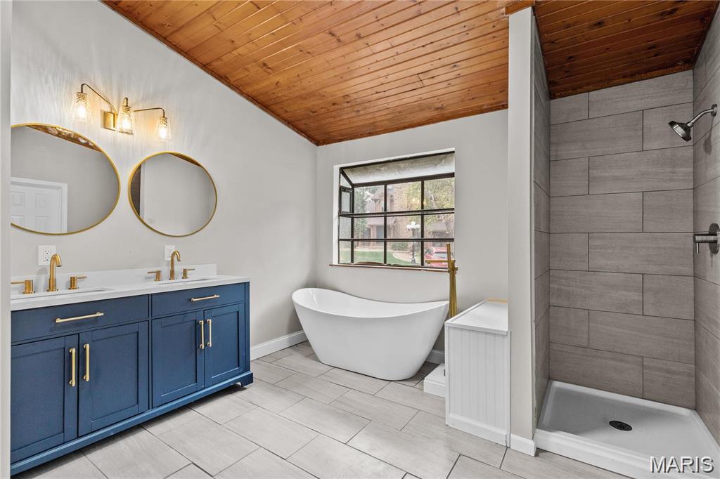 NO OPEN HOUSE ON SATURDAY, JUNE 6, 2026. Must-See with TWO Primary Suites!
This stylish, move-in-ready condo truly stands out. Offering the feel of a spacious townhome, it features luxury vinyl plank flooring, modern paint throughout, a new electrical panel, new HVAC in 2024, updated lighting, and a beautifully renovated kitchen and baths.

Step inside and you’re immediately greeted by a stunning floor-to-ceiling fireplace in the great room, soaring ceilings, and an open, airy layout highlighted by a dramatic catwalk above. The updated kitchen is a showstopper with stainless steel appliances, white shaker-style cabinetry, granite countertops, custom tile backsplash, pantry, and a peninsula with breakfast bar—perfect for everyday living and entertaining. From here, step out to the large deck overlooking the level common ground.

The main-floor primary suite offers a walk-in closet, private patio access, and a spa-like bath with double sinks, soaking tub, and separate shower. Also on the main level: a separate dining room, updated half bath, and convenient main-floor laundry.

Upstairs, you’ll find a second primary suite, complete with its own walk-in closet, private deck, and updated full bath—ideal for guests or multi-generational living.

The finished lower level expands your living space with a rec room, family room, and ample storage/utility area. Plus, enjoy the convenience of a 1-car garage. The 1-car garage that belongs to Unit A is the one closest to the actual condo.

Location perks: Ground-level, interior unit offering both privacy and easy access.

This home checks all the boxes—space, style, and flexibility. FHA eligible. Don’t miss it! OPEN HOUSE June 6, 2026 12pm to 2pm.