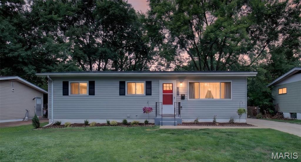Completely renovated and absolutely move-in ready, this stunning ranch offers the perfect blend of timeless character, modern updates, and worry-free ownership in one of Ferguson’s most desirable locations. Situated on a quiet street just one block from Forestwood Park, this exceptional residence delivers outstanding curb appeal with brand-new premium siding, a new roof, fresh landscaping, newer Low-E windows, and an inviting exterior that immediately feels like home. Step inside to discover beautifully refinished original oak hardwood flooring, recessed lighting, designer-inspired colors, and an open, welcoming atmosphere that perfectly balances warmth and style. The updated kitchen serves as the heart of the home, featuring custom cabinetry, sleek finishes, and a complete suite of stainless steel appliances including a gas range, creating the ideal space for both everyday living and entertaining. The finished lower level nearly doubles the home's living space and offers incredible flexibility. A massive recreation room provides endless possibilities for movie nights, game days, or entertaining guests, while the private bonus room is perfectly suited for a home office, fitness area, hobby room, or additional sleeping quarters. The spotless utility area includes the washer and dryer for added convenience. Step outside to a covered patio overlooking the fully fenced backyard, creating a private outdoor retreat perfect for relaxing evenings, weekend gatherings, and pets or play. An expansive driveway provides abundant off-street parking, while the electrically equipped storage shed offers exceptional functionality for hobbies, projects, or additional storage. Beyond the beautiful finishes and thoughtful updates, this home delivers something truly rare—exceptional peace of mind. With a 10-year workmanship warranty on the roof, transferable warranties on appliances and landscaping, newer mechanical systems, and extensive improvements throughout, buyers can enjoy confidence and security for years to come. Located just minutes from downtown Ferguson, the Farmers Market, Plaza at 501, restaurants, parks, and convenient access to I-70, this remarkable home offers the perfect combination of charm, location, and modern convenience. Opportunities like this are rare—schedule your private showing today and experience everything this exceptional home has to offer.