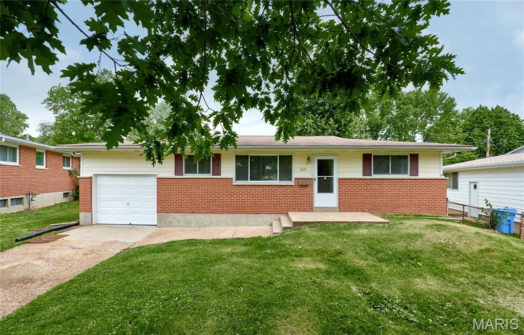 Great location in the heart of Florrissant! This updated and very clean ranch home sits in a quiet setting and is perfect for relaxing or entertaining. It has great curb appeal, hardwood floors, a finished basement, screened-in porch with a hot tub, and many updates throughout. The main floor features a large open living and dining area, 3 bedrooms, and 2 updated bathrooms, including one with a jetted tub. The primary suite includes a private updated bathroom, walk-in closet, and custom vanity cabinets. The finished lower level offers plenty of extra space with a bonus rooms that can be used as a sleeping room, an office, gym, or hobby room. It also includes a media room, family/recreation area, wet bar, half bath, laundry room, and custom shelving. Enjoy the peaceful backyard with a garden, large patio for BBQs, and screened-in porch with hot tub. Pets require approval and additional fees, hurry and schedule your showing today this one won't last!