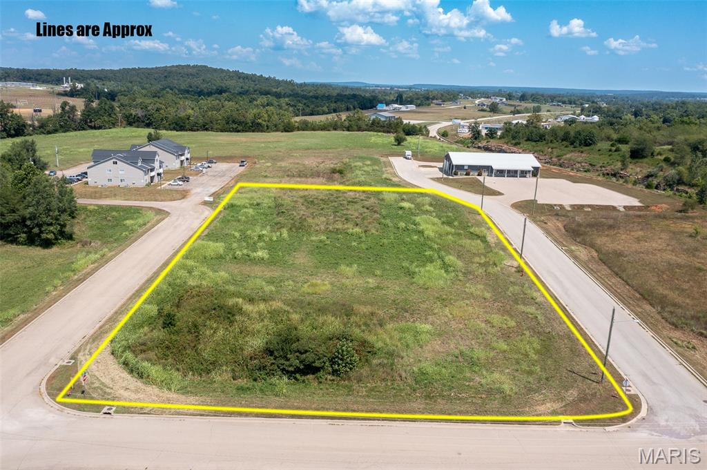 -COMMERCIAL LOT IN FREDERICKTOWN, MO-   This 1.84 acre property is located near multiple high traffic highways and businesses. Road frontage on 3 sides allows flexibility in development and endless opportunities for use. Electric and water are on site and sewer is available.