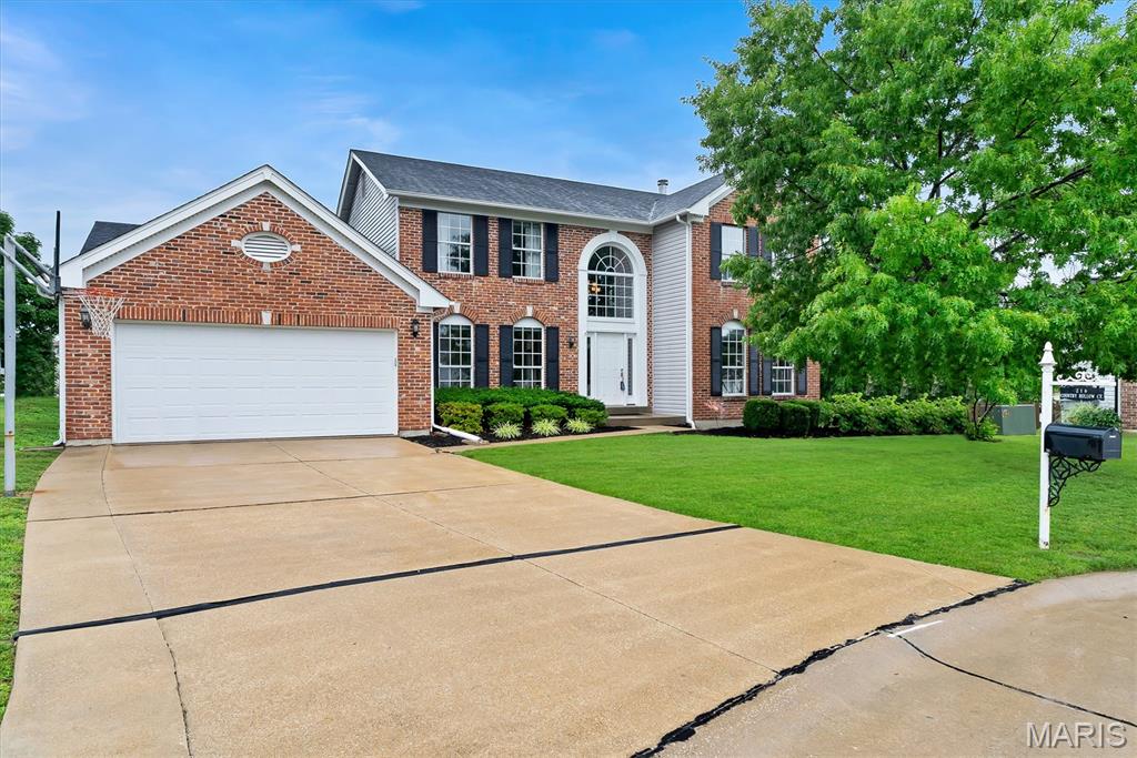 Nestled on a cul-de-sac in the highly sought-after, award-winning Francis Howell School District, this exceptional 4-bedroom, 3.5-bath residence offers an impressive blend of elegance, comfort, and modern sophistication. From the moment you arrive, the stately brick facade and manicured landscaping create a striking first impression. Inside, you'll discover thoughtfully curated living spaces designed for both everyday living and entertaining. The heart of the home is a stunning kitchen with beautiful cabinetry, a stone backsplash, oversized center island, stainless steel appliances, walk-in pantry, planning station, and abundant natural light. The adjoining breakfast room opens seamlessly to an expansive deck, creating the perfect indoor-outdoor flow. The inviting great room showcases hardwood flooring, a dramatic stacked-stone fireplace, recessed lighting, and an atrium door leading to the outdoor living area. A private executive office with hardwood floors provides an ideal work-from-home setting, while the formal dining room offers an elegant space for hosting memorable gatherings. Retreat to the luxurious vaulted primary suite featuring a massive walk-in closet and a spa-inspired bath designed for relaxation. Three additional bedrooms complete the upper level. The finished lower level expands your living space with a spacious recreation room, full bath and sleeping quarters/office, offering flexibility for multigenerational living or visitors. Additional highlights include dual HVAC systems, a 50-gallon water heater, roof replaced in 2025, two laundry areas (main floor and lower level), and exceptional storage. Step outside to enjoy the beautifully landscaped backyard featuring a large, covered deck and a separate grilling terrace—perfect for entertaining, summer evenings, and year-round enjoyment. Combining timeless elegance, modern updates, and an outstanding location, this remarkable home truly offers luxury living at its finest. Close to shopping, dining and schools!  Don't miss out!