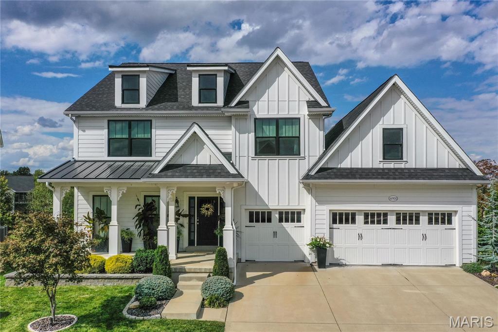 This gorgeous 1.5 story home is sure to impress from the inside out. Tall ceilings, light filled rooms, and beautiful finishes throughout create an inviting space you’ll love coming home to. The stunning kitchen features sleek stainless appliances, including double ovens, a large breakfast bar, walk-in pantry, floating shelves, and enough counter space to prep the most ambitious meals you can imagine. It’s open to the dining area as well as the showstopper of a great room, which has a sky-high vaulted ceiling, huge windows, built-ins, and a warm fireplace you’ll want to relax around on chilly evenings.  The bright office will make you want to work from home. Outside, the serene screened in patio leads to the composite deck overlooking a lushly landscaped, fenced-in backyard. The main floor primary bedroom suite has a spacious bathroom with separate soaking tub, dual sink vanity, and an enviable walk-in closet. Upstairs, the loft space offers an additional flex area to suit your family’s needs. Two bedrooms share a jack-and-jill bath, and another has its own ensuite. The finished walkout lower level is the perfect multi-generational living solution. The full living quarters include a bedroom with large walk-in closet and full ensuite bath, a living room, dining area, kitchen, separate laundry, and a private sitting area outside on the patio. There is still plenty of basement storage space too, and the three-car garage is extra deep offering space for more storage and to comfortably park your larger vehicles. 3M sun control window film in the primary bedroom and great room keep the hot afternoon sun out without sacrificing the natural light.