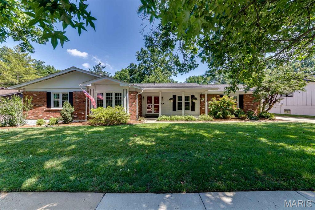 Welcome home to this spacious 4-bedroom, 2-bath ranch offering over 2,400 square feet of comfortable living space in the highly sought-after Parkway School District. Designed for both everyday living and entertaining, the home features a gracious entry foyer, formal living room, separate dining room, and an inviting family room complete with a wood-burning fireplace and wet bar. The updated eat-in kitchen showcases quartz countertops, white appliances, and overlooks the park-like backyard that backs to beautiful common ground. Hardwood flooring extends throughout the main living areas, while the bedrooms offer the comfort of carpet. Large bedrooms, abundant closet space, main floor laundry, and oversized living areas provide a functional layout with room for everyone. Step outside to enjoy the peaceful backyard from the patio, with access from both the kitchen and family room. The rear-entry 2-car garage enhances the home's curb appeal, while the expansive unfinished basement offers exceptional storage and endless possibilities for future living space. A rare combination of size, layout, location, and setting makes this one a home you won't want to miss.
